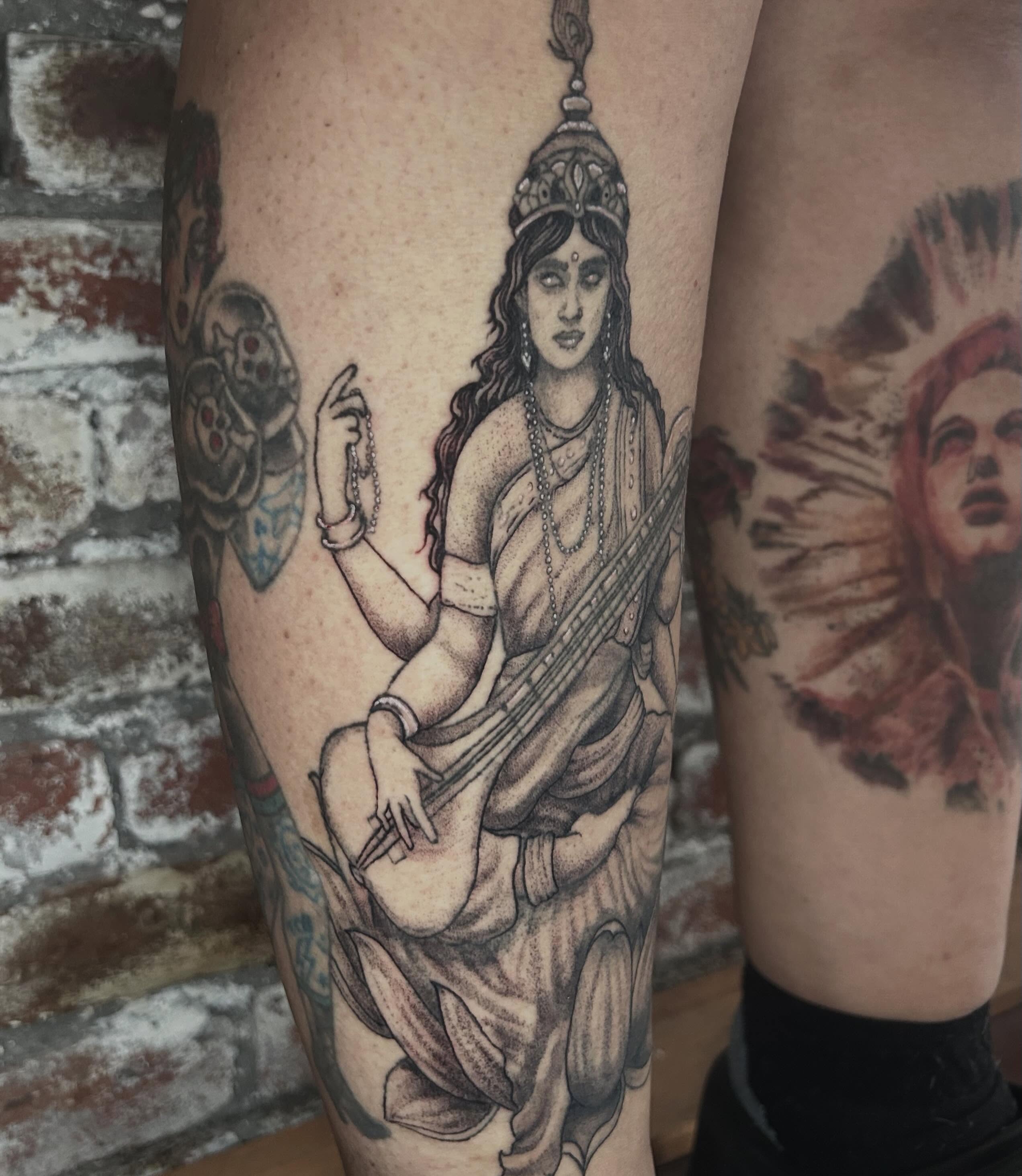 Goddess playing sitar dotwork tattoo on the thigh by ๐๐๐๐๐๐ ๐๐๐๐๐๐ ๐๐๐๐๐๐
