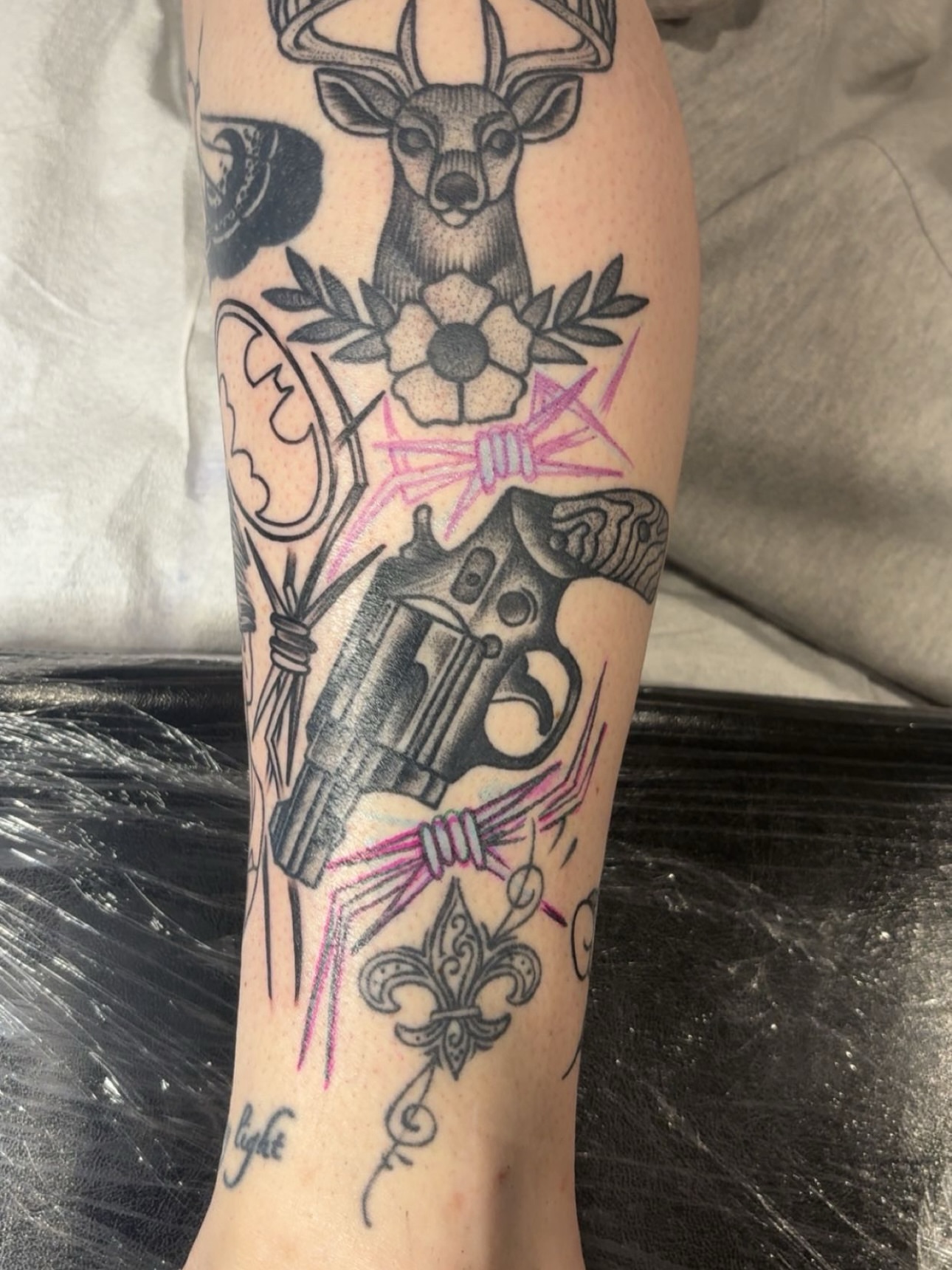 Gun and deer American traditional tattoo on the forearm by Chris Prince Jr., Miamisburg, Ohio