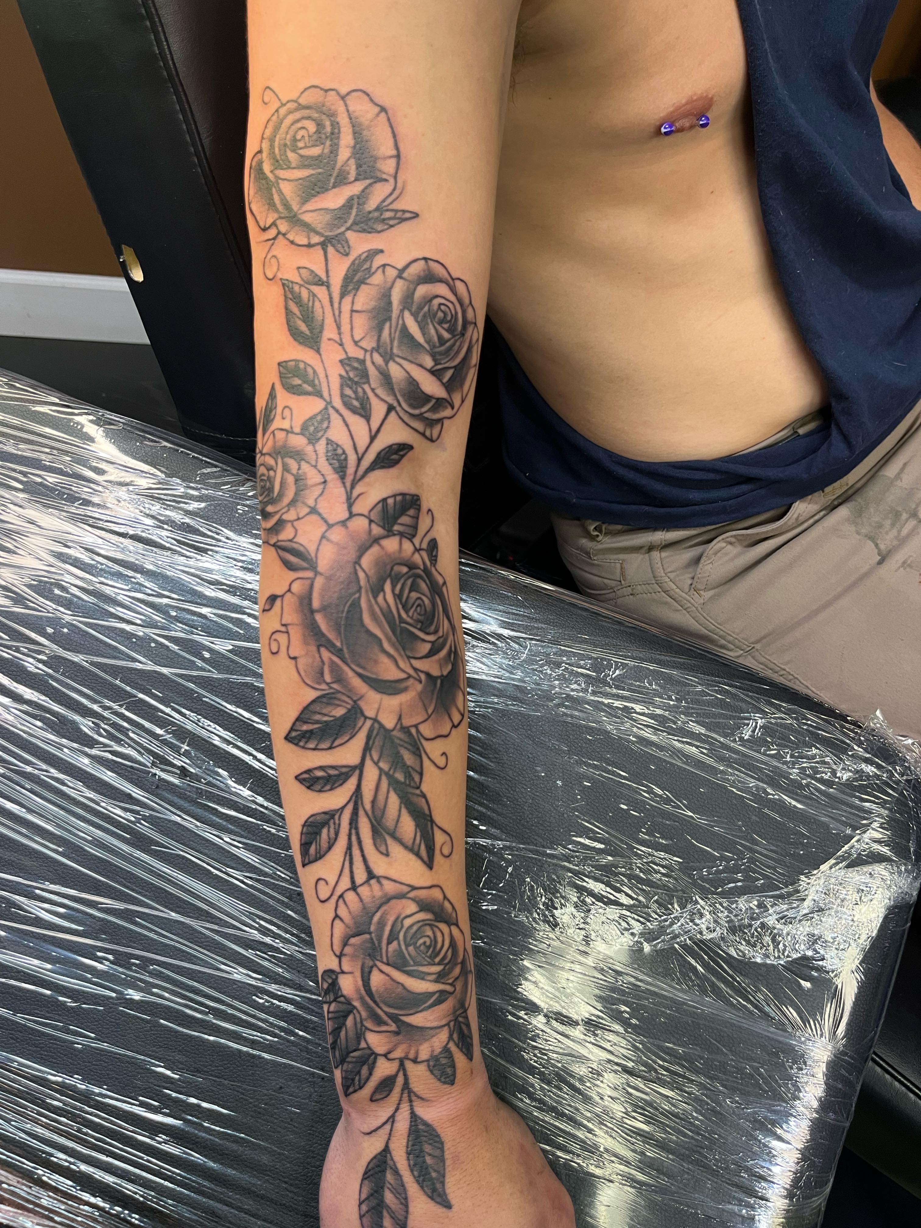 Roses black and grey tattoo on the forearm by Darius Armour (Tattoo Artist)