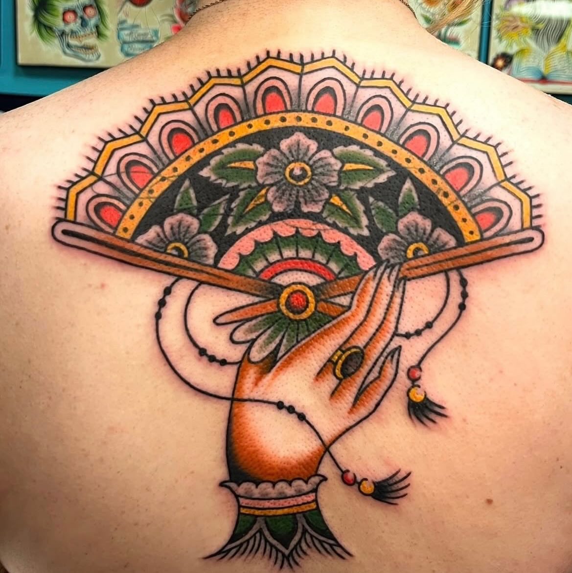 Fan American traditional tattoo on the back by Macy Bird