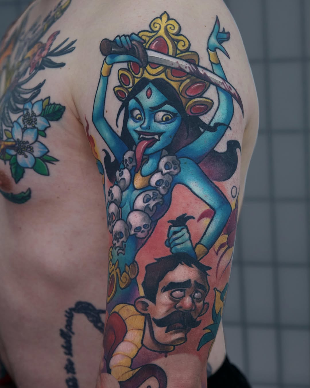 Demoness with sword American traditional tattoo on the upper arm by Lena Aleksandrova