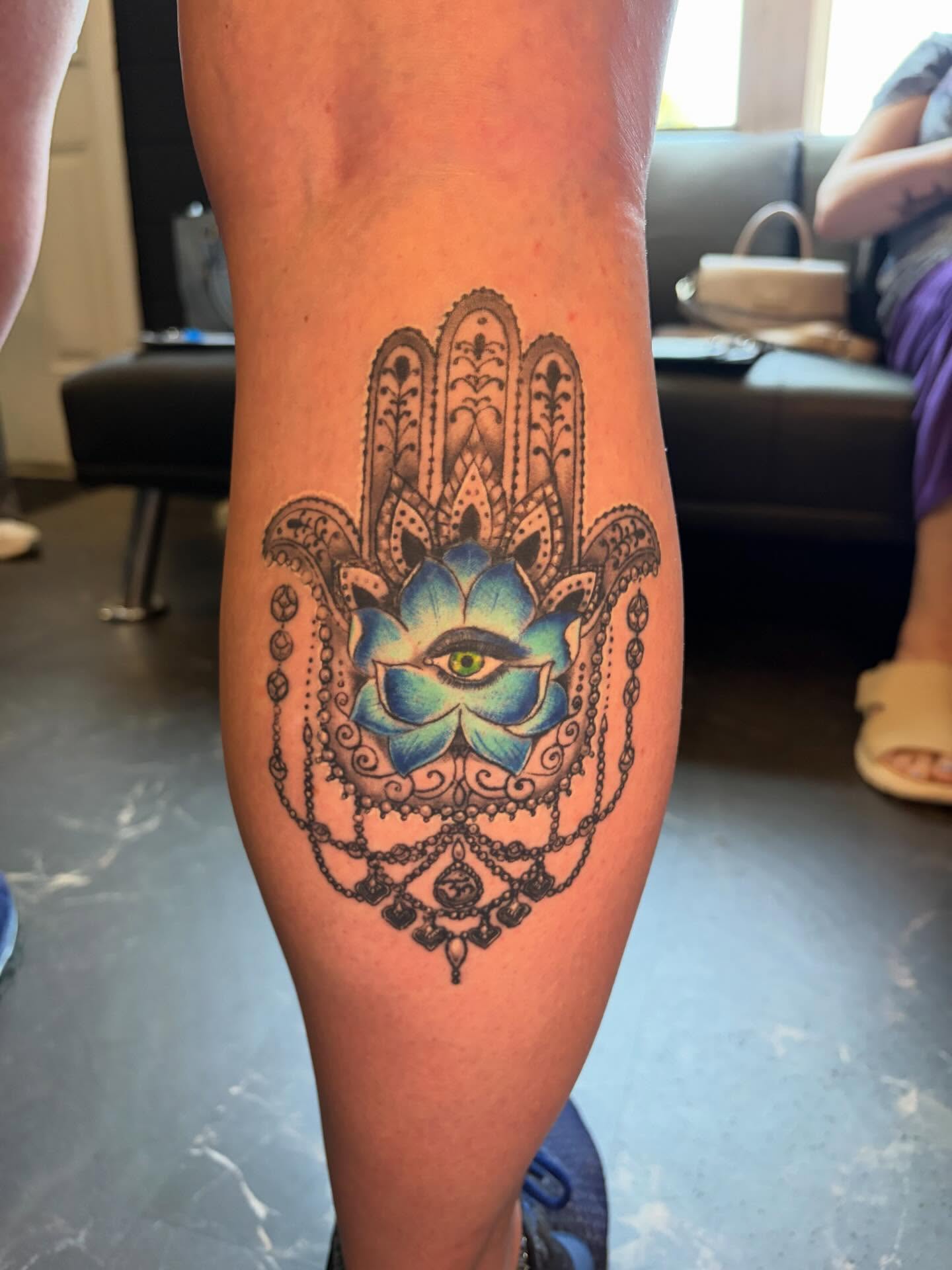 Hamsa hand geometric tattoo on the leg by Fredrick Tigerman