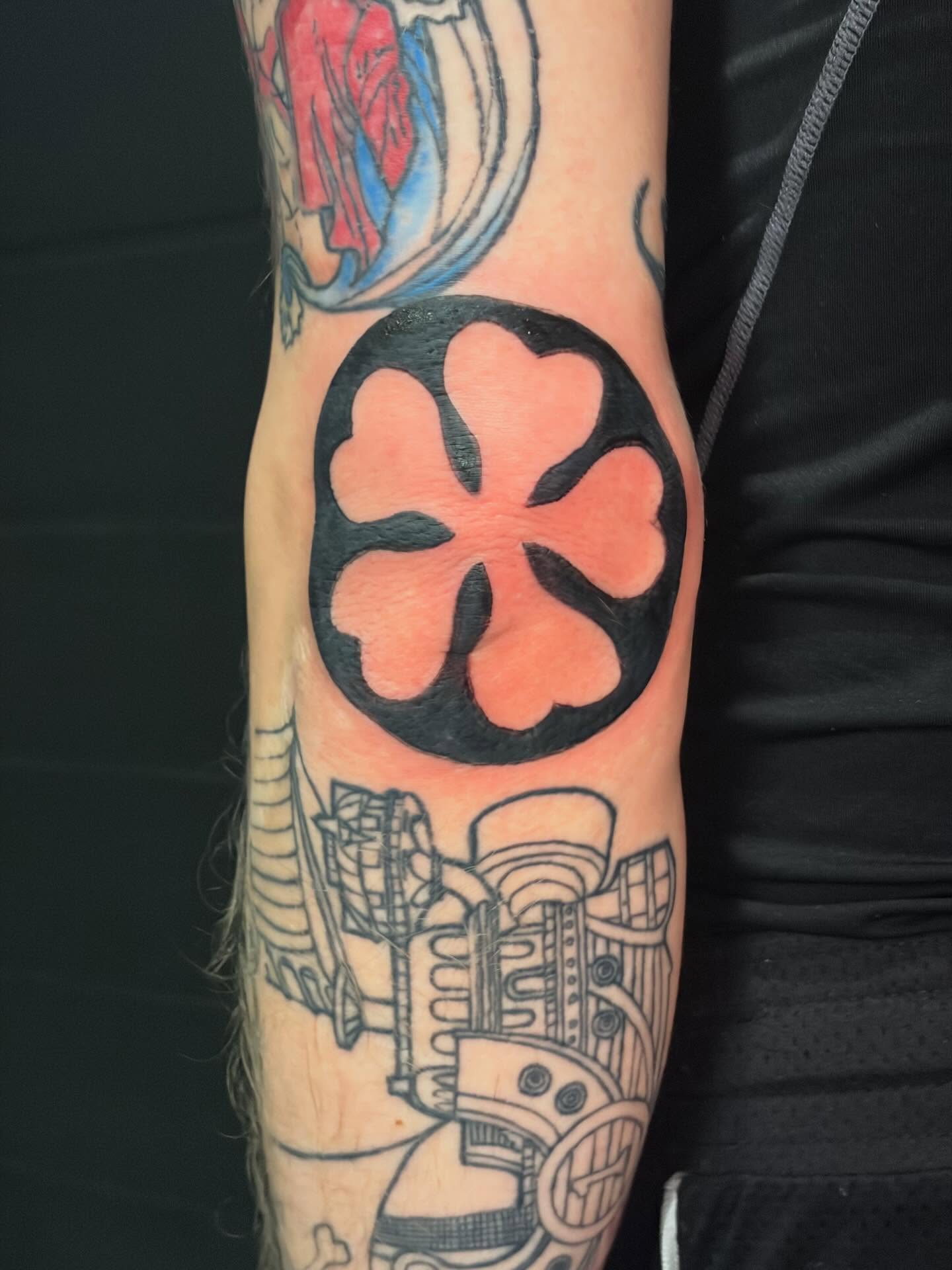 Cross geometric tattoo on the forearm by Fredrick Tigerman