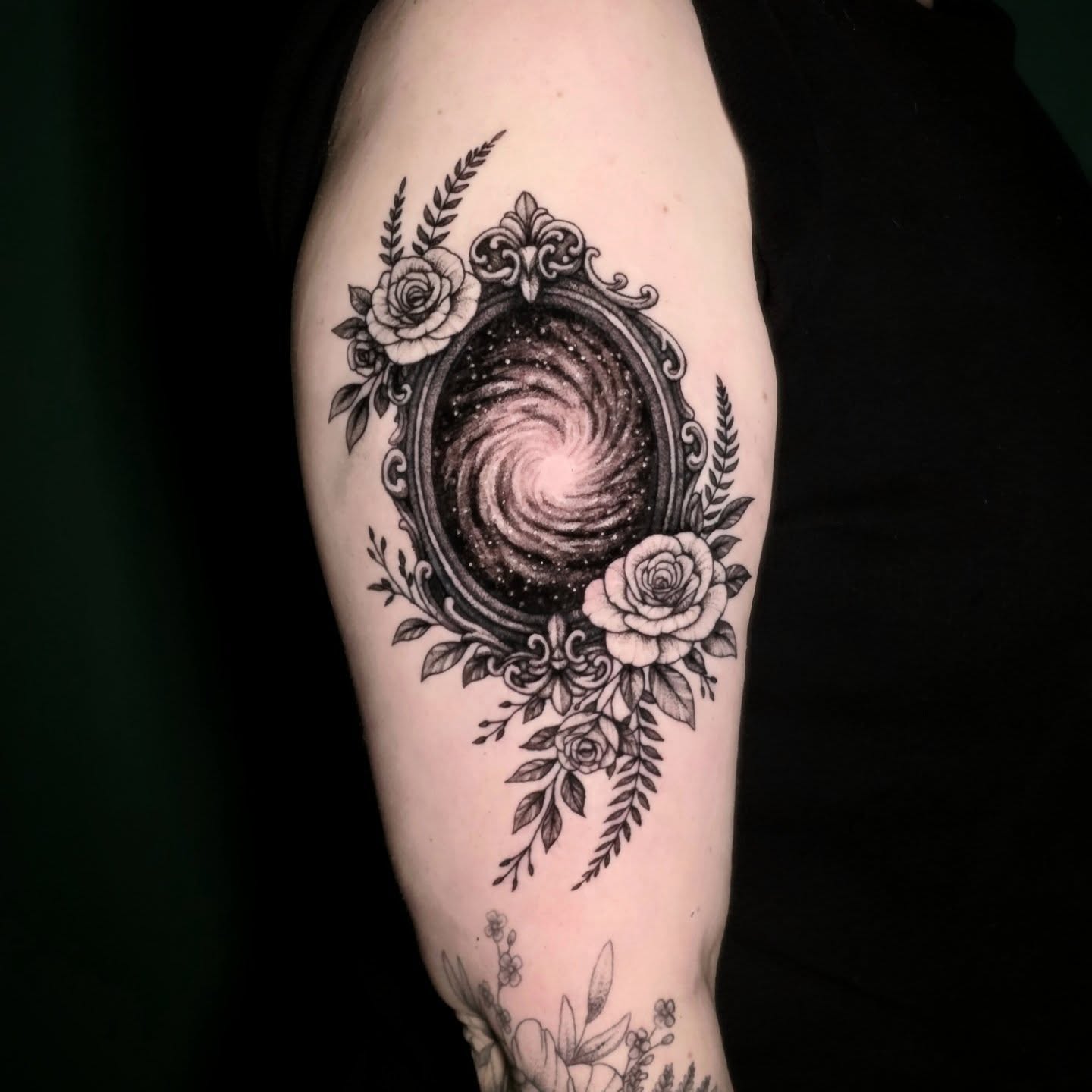 Galaxy in mirror ornamental tattoo on the forearm by Nick de Hoyos