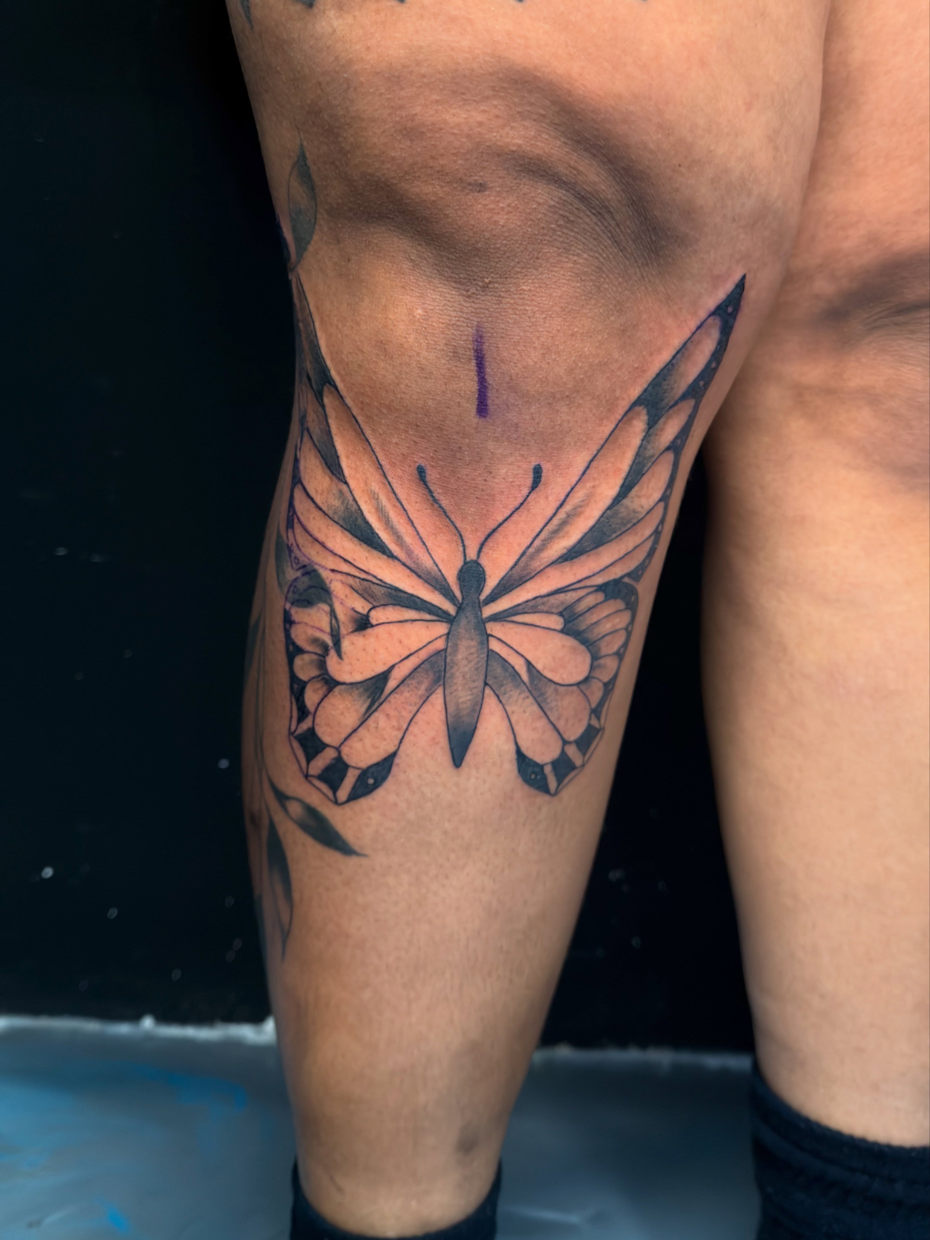 Butterfly realism tattoo on the thigh by David Yancy III