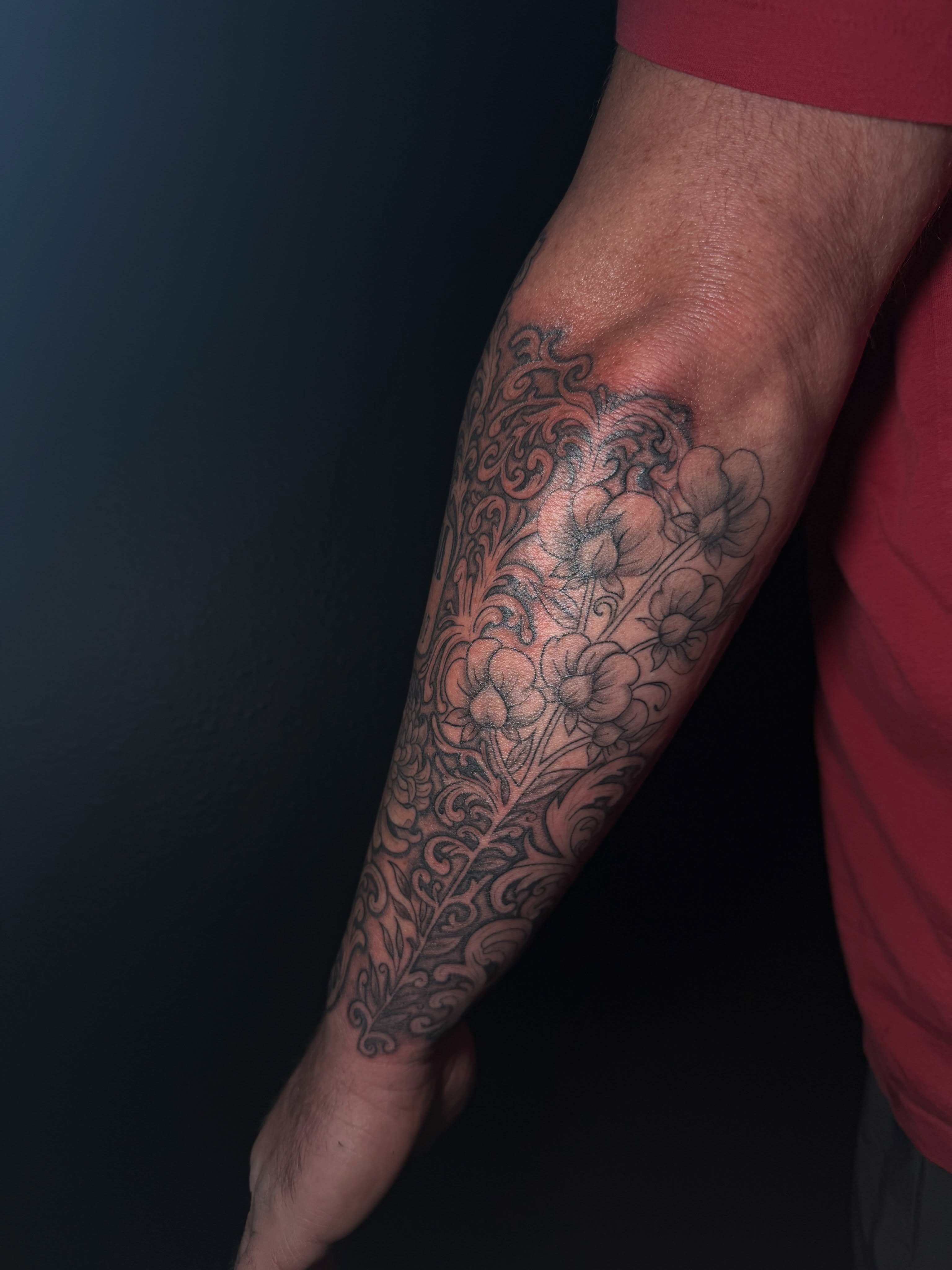 Floral vine black and grey tattoo on the forearm by Ink Darling, Carlisle, Iowa