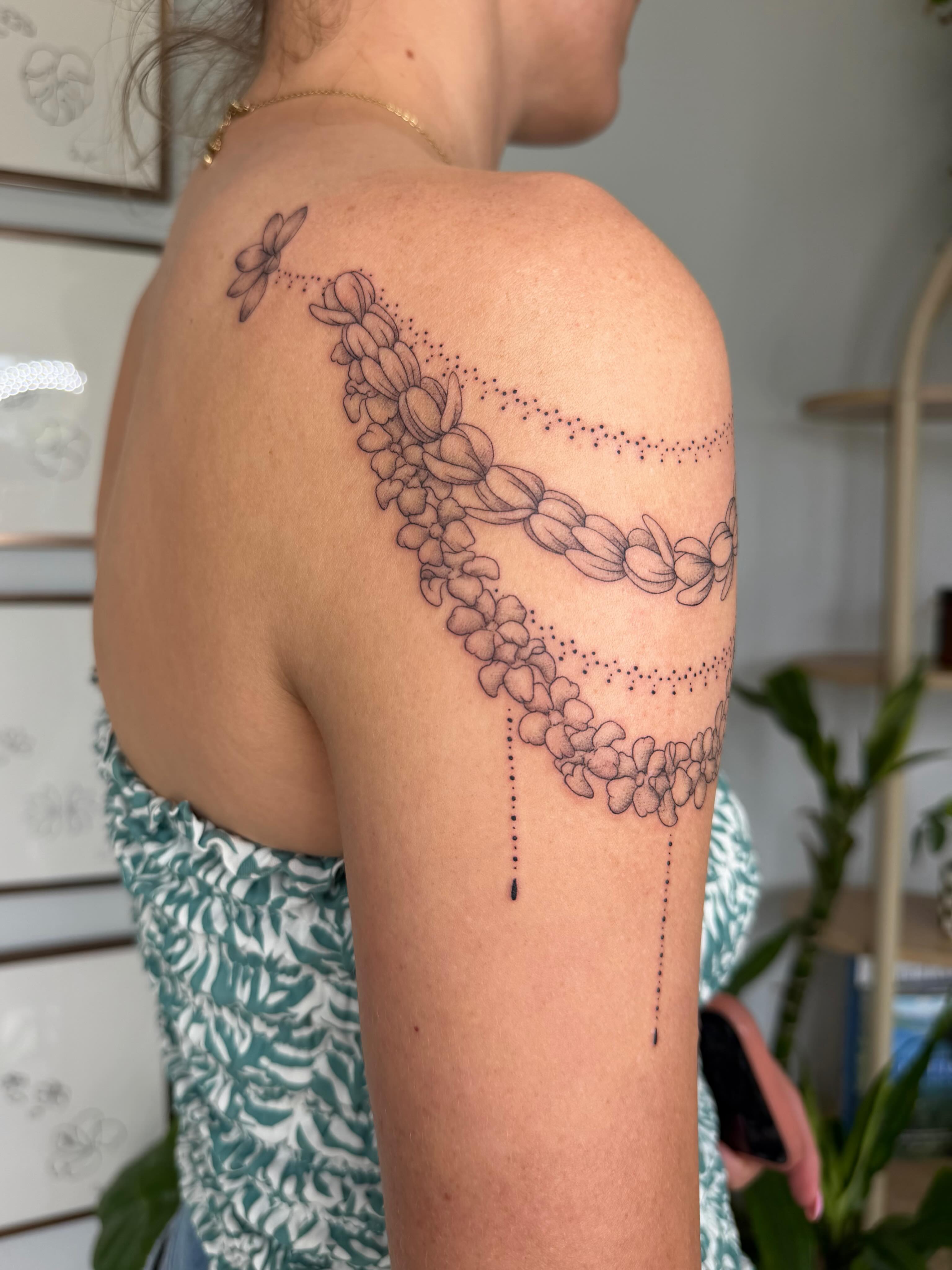 Flower chain dotwork tattoo on the shoulder by Priscila - HAWAII TATTOO