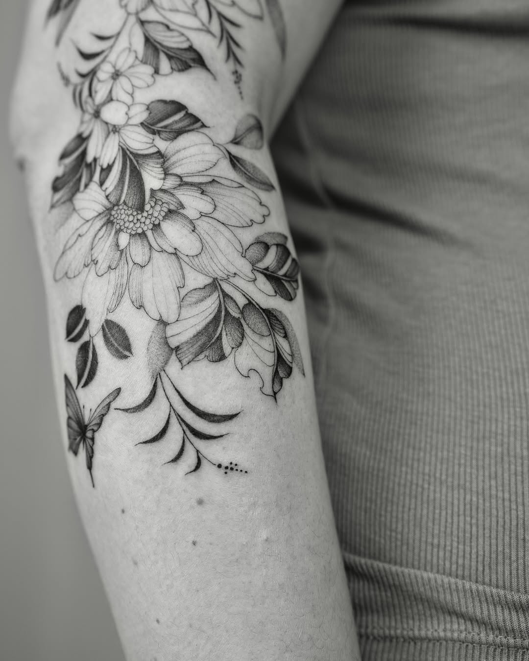 Floral arrangement dotwork tattoo on the forearm by Leo Gao