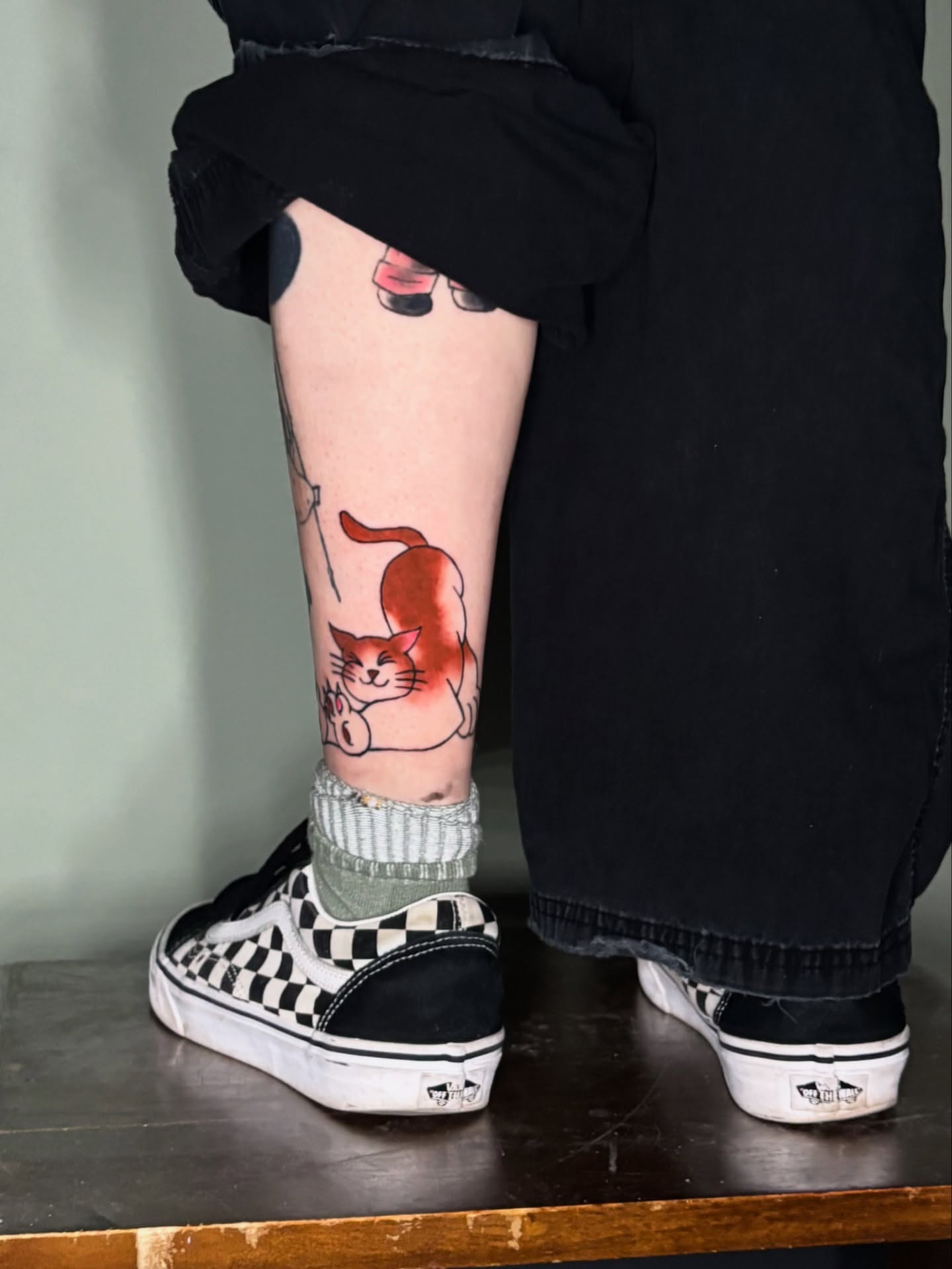 Cat anime tattoo on the leg by Gabe Rosen