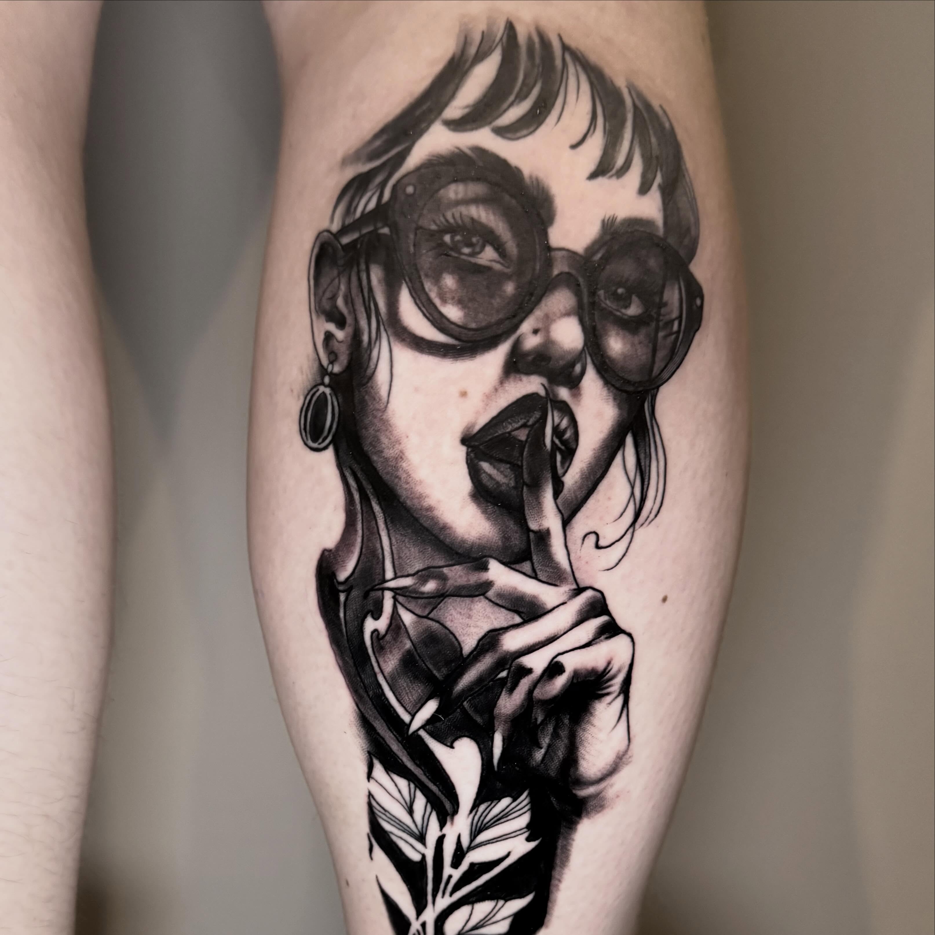 Woman with glasses realism tattoo on the forearm by Mike Bean, Minneapolis, Minnesota