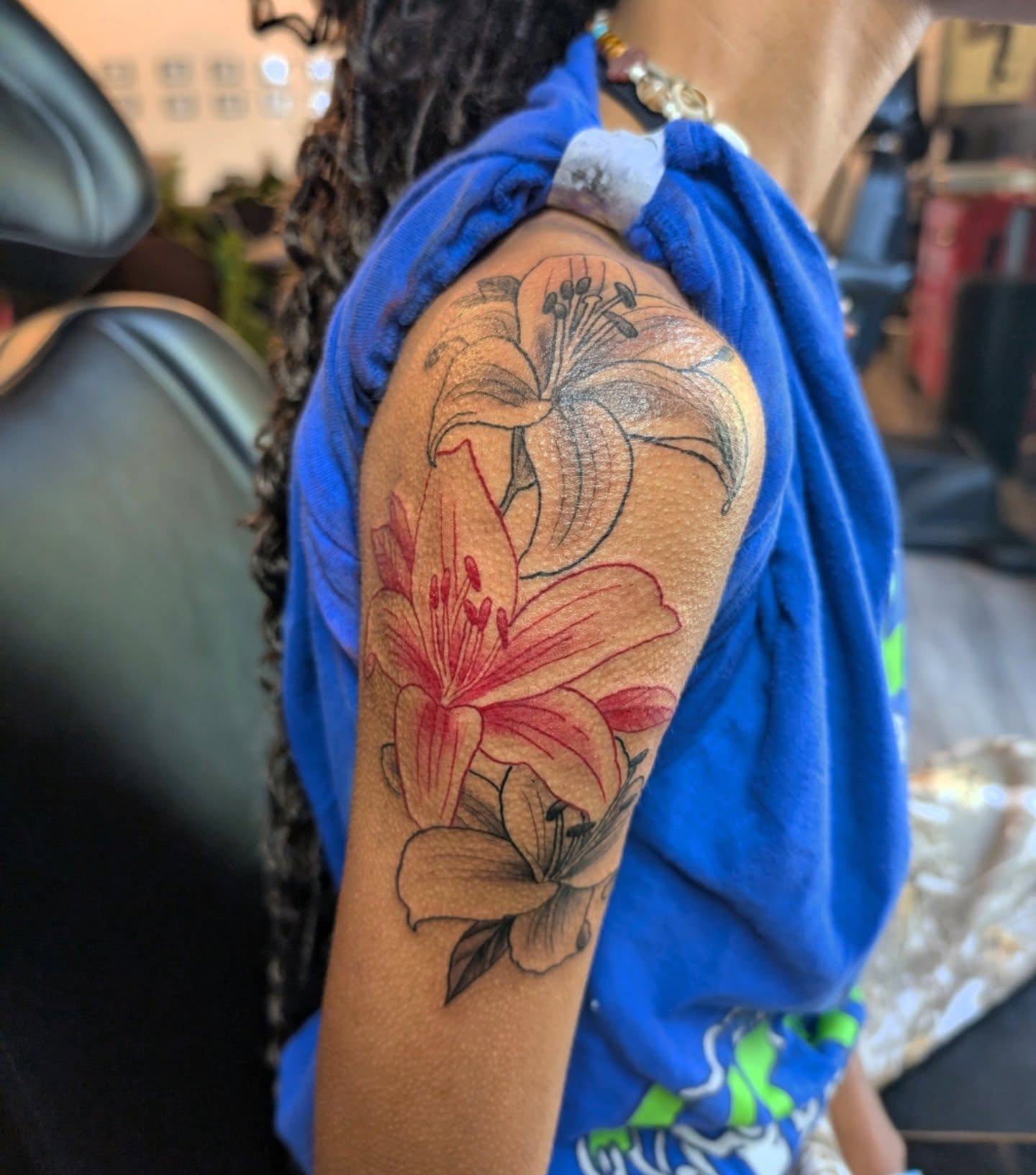Lilies black and grey tattoo on the shoulder by Ashton Allen-Ruiz, Portland, Oregon