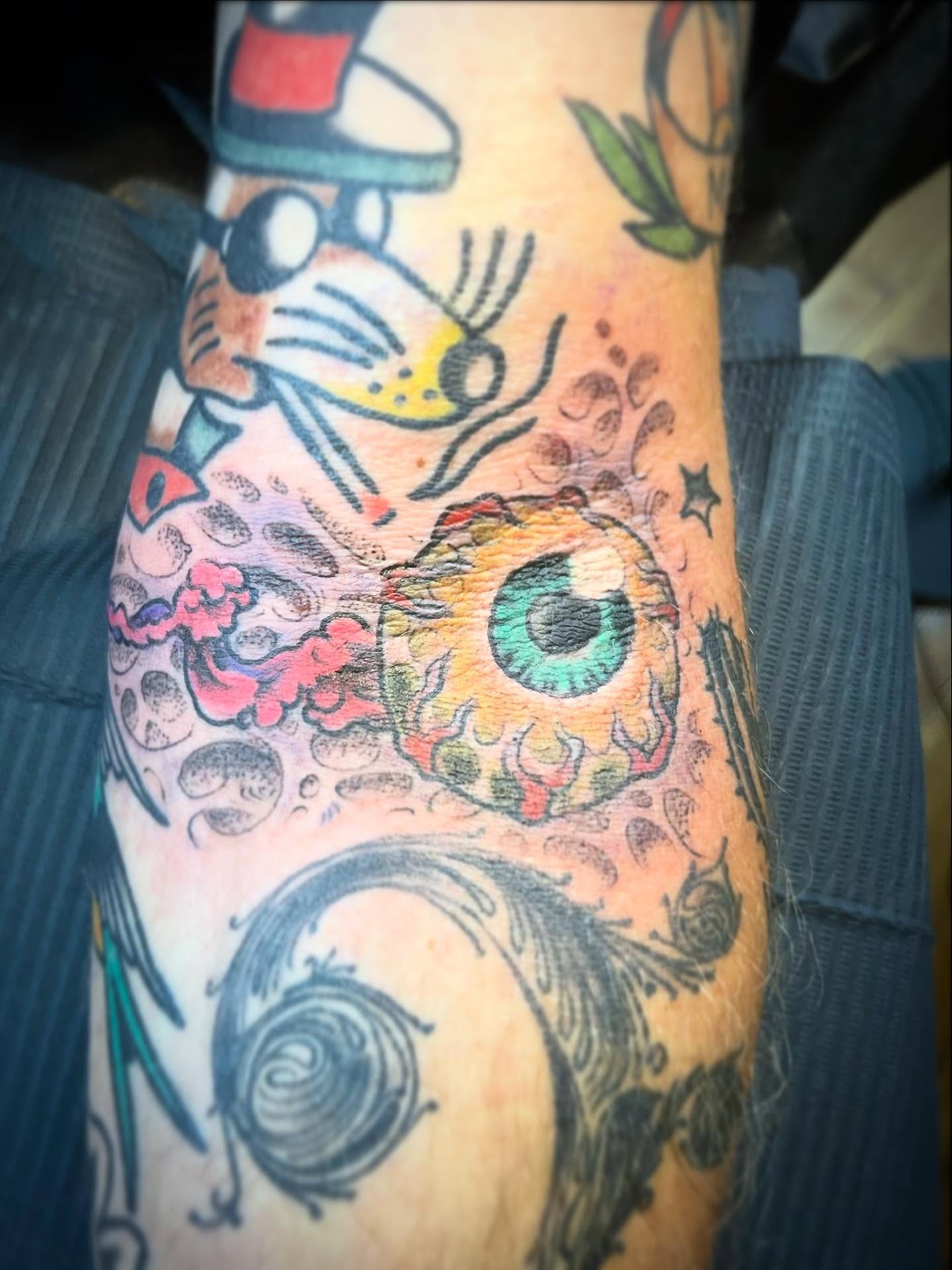 Eye and cat American traditional tattoo on the forearm by Andrew Snowden