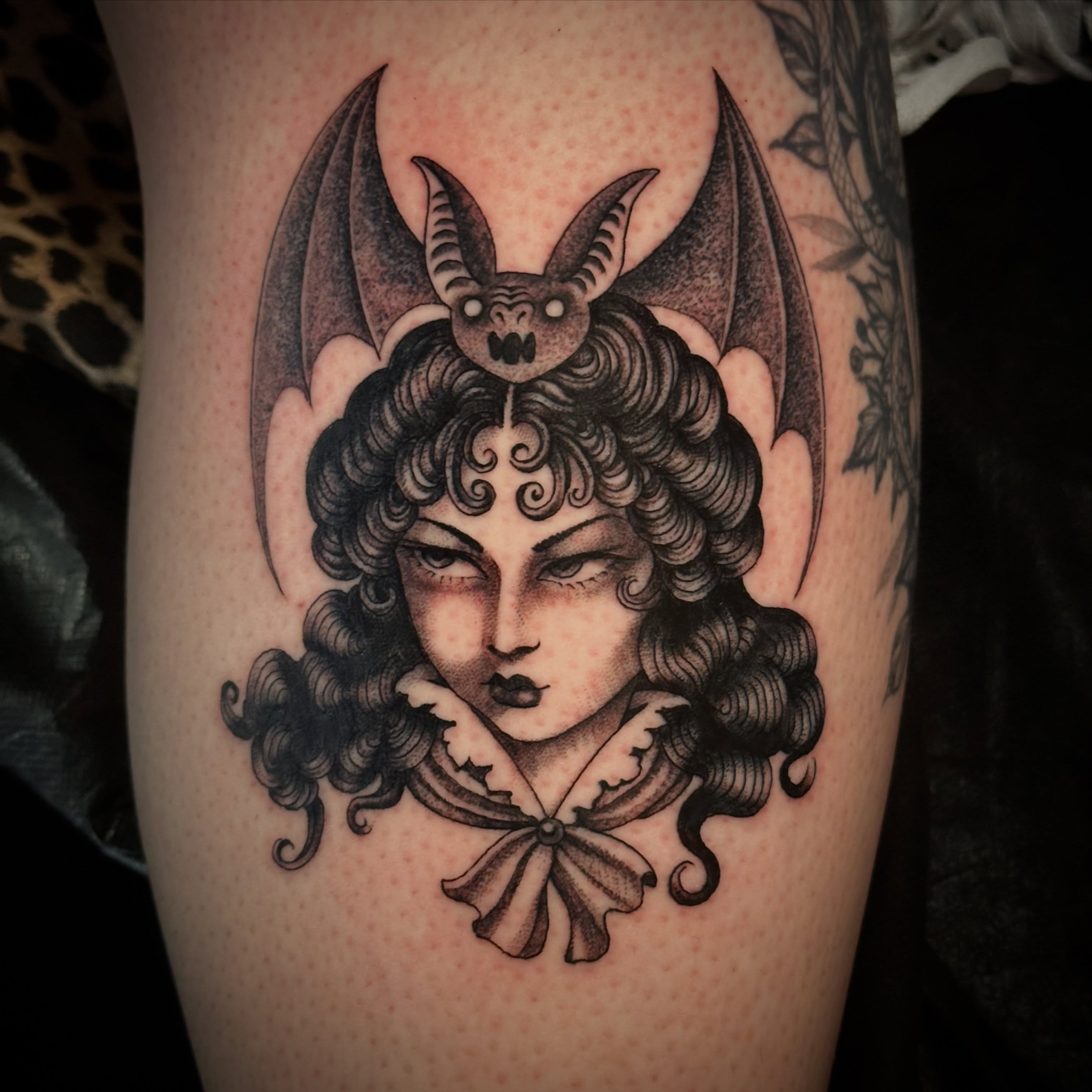Woman with bat wings realism tattoo on the forearm by Bree Lin