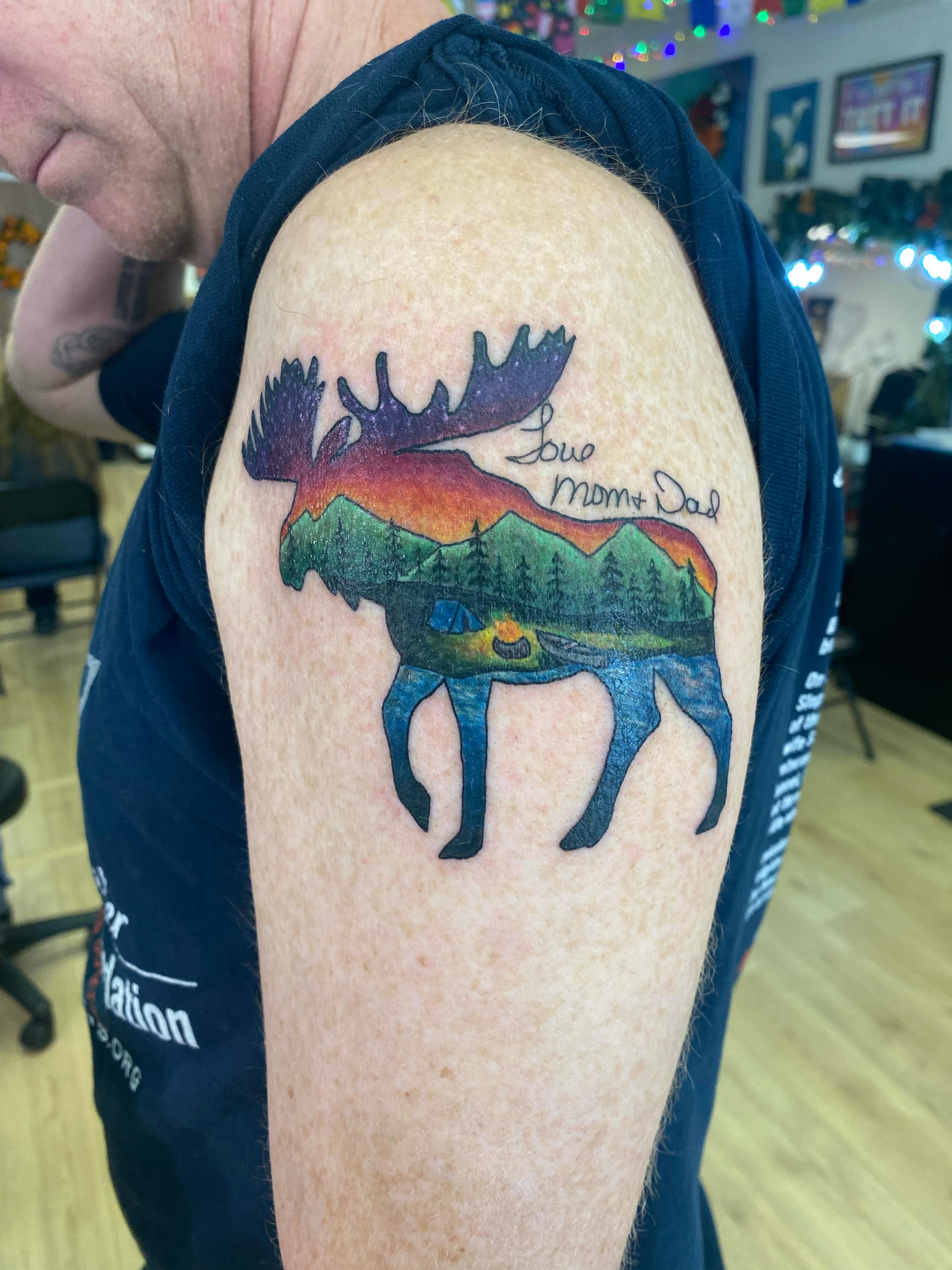 Moose silhouette dotwork tattoo on the shoulder by Katie Leeper