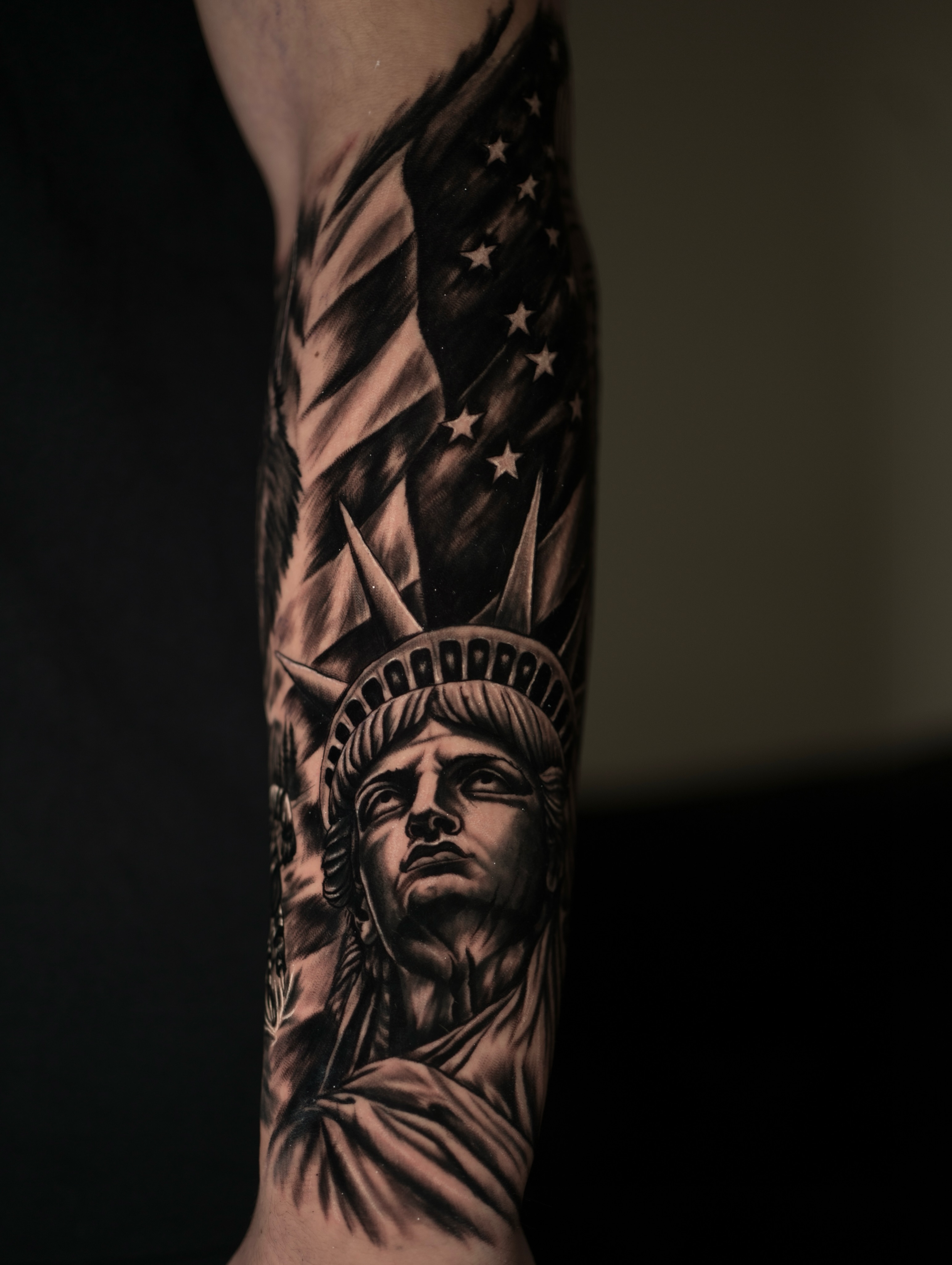 Statue of liberty realism tattoo on the forearm by Juan David Arias