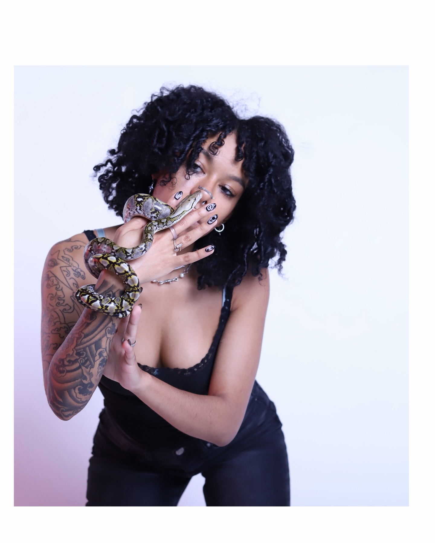 Snake American traditional tattoo on the upper arm by Las Vegas Artist π©π½βπ¨