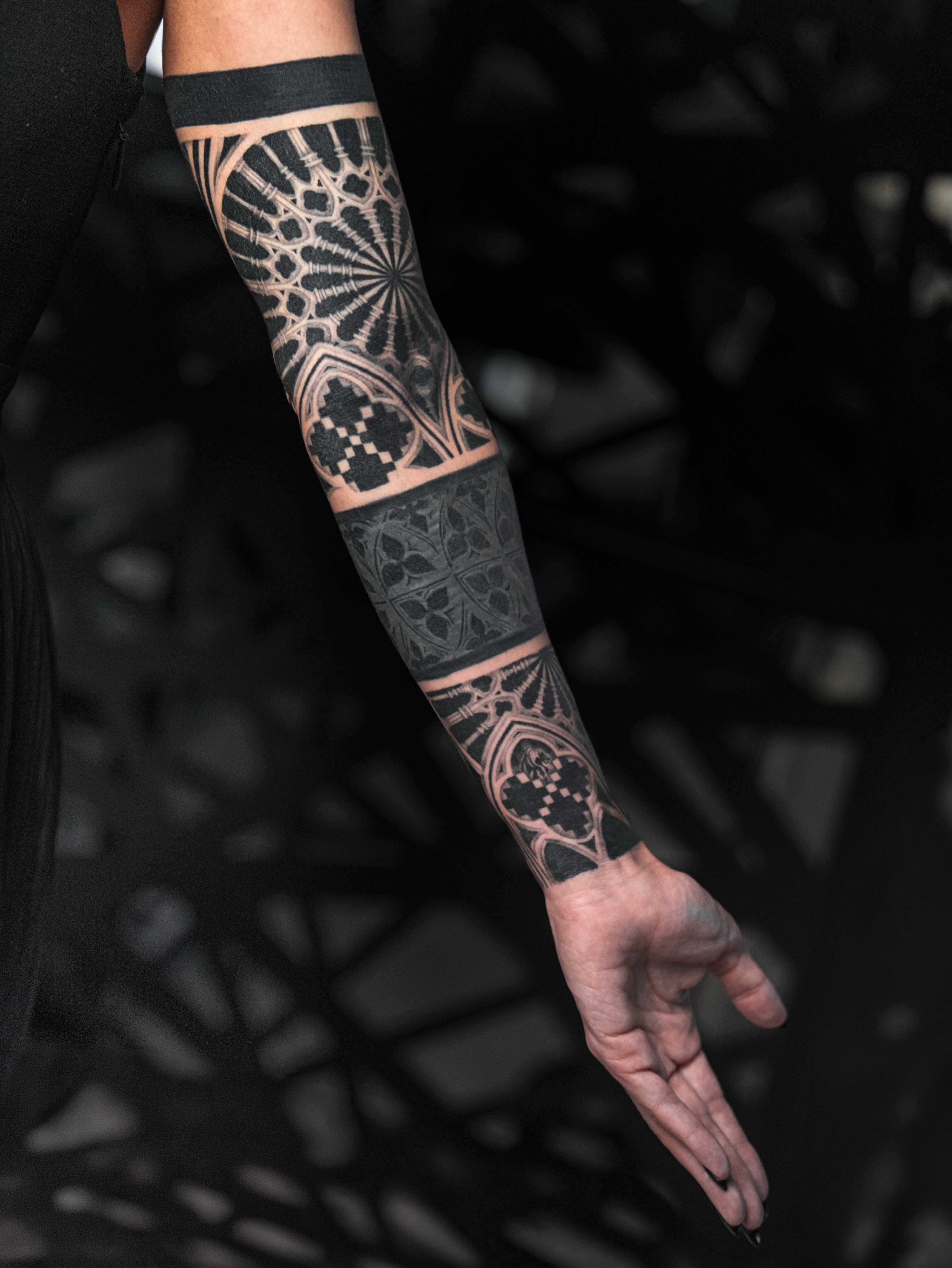 Gothic architectural patterns geometric tattoo on the forearm by Ilya Cascad Kandaurov