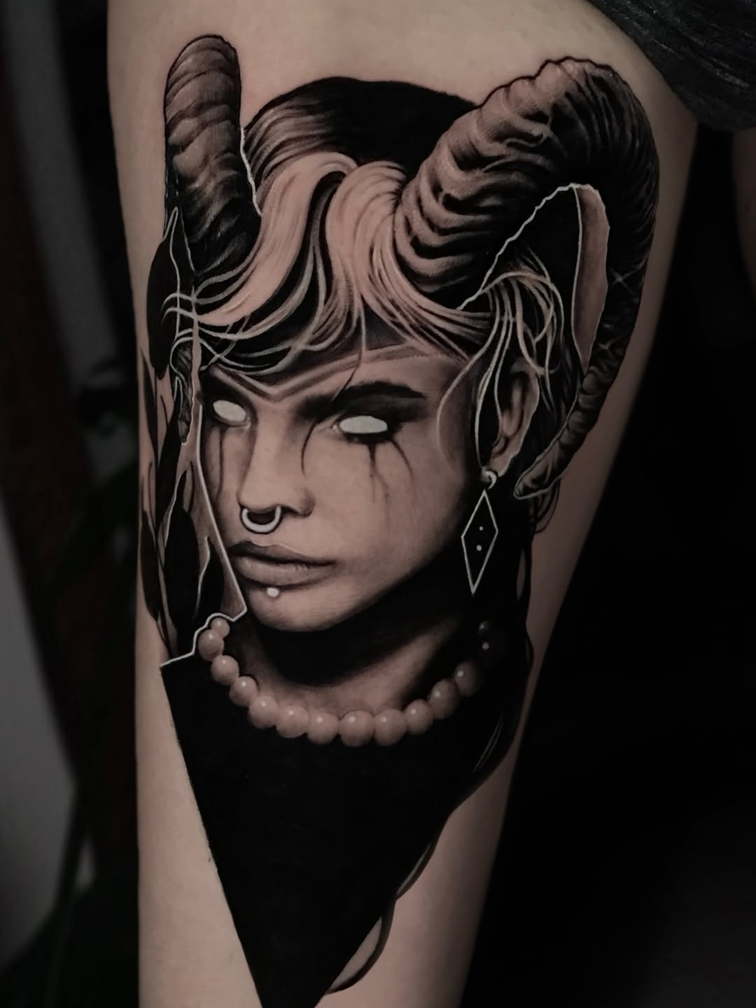 Demon woman with horns realism tattoo on the forearm by Aren