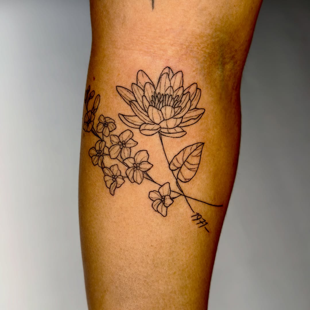 Lotus and flowers fine line tattoo on the forearm by Charlotte (Luna), Seattle, Washington