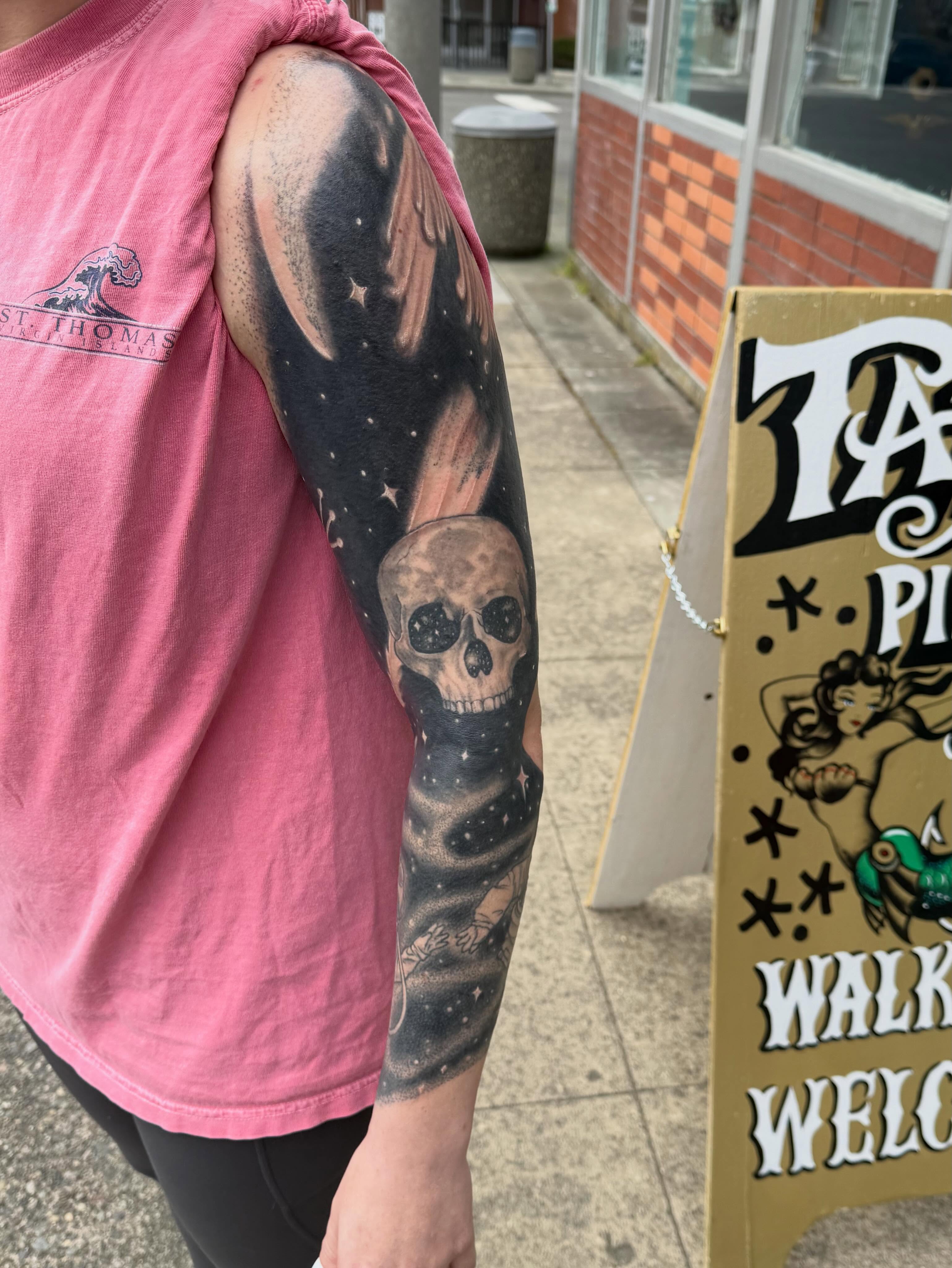 Space skull realism tattoo on the upper arm by Levi Sawdon, Everett, Washington