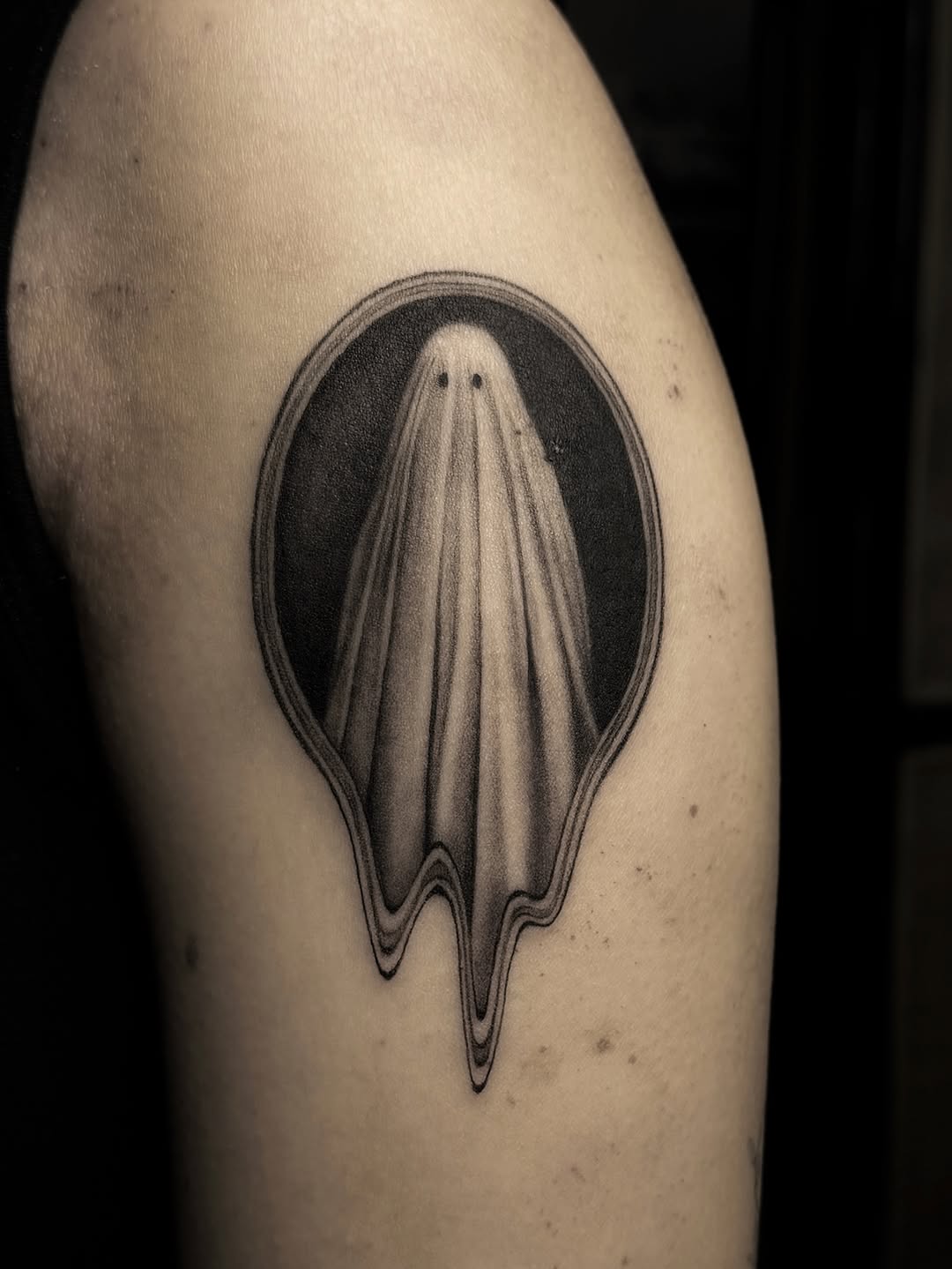 Ghost in a frame dark art tattoo on the upper arm by hiba ⊹ atlanta tattoo artist, Johns Creek, Georgia