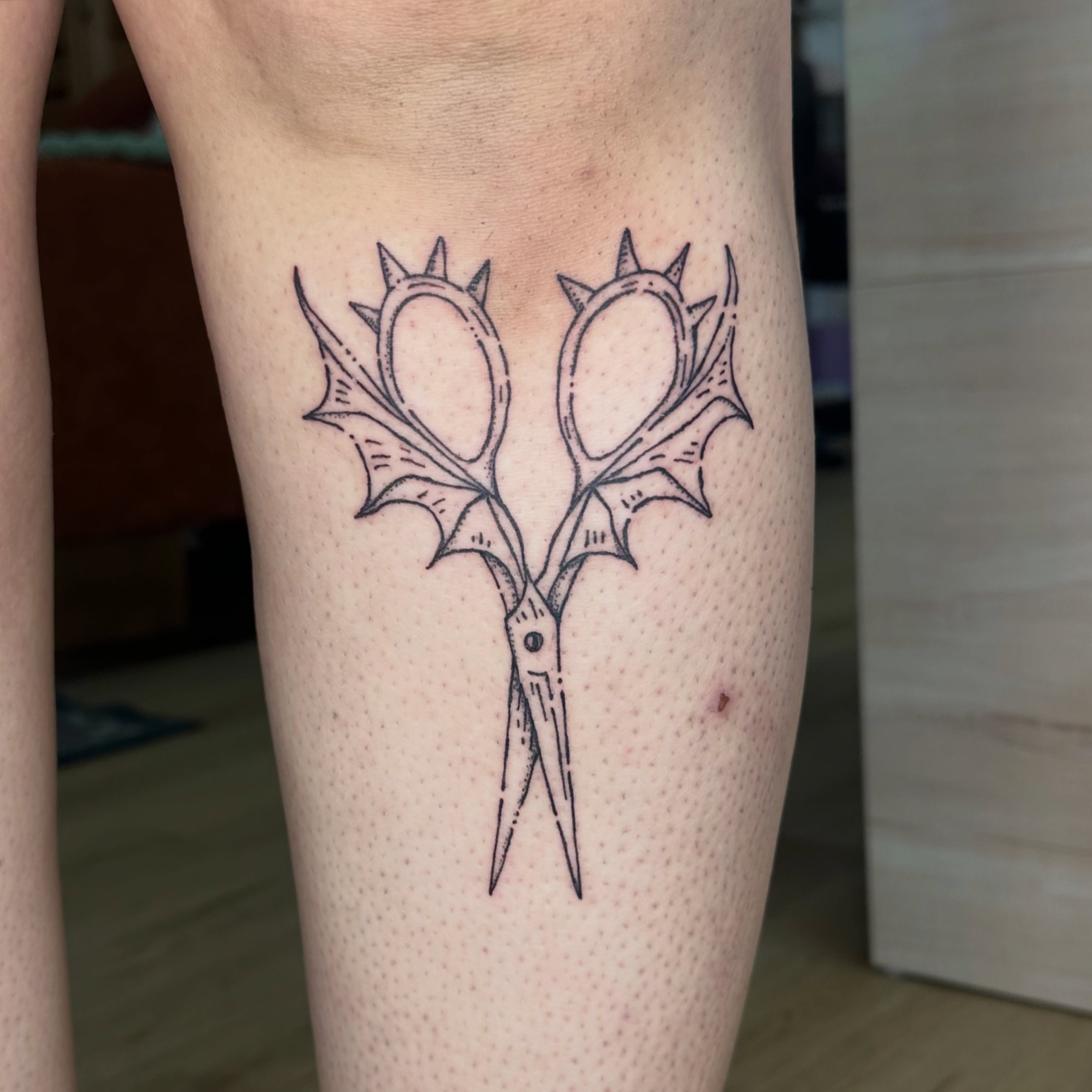 Scissors black and grey tattoo on the leg by Fleur ๐ฅ