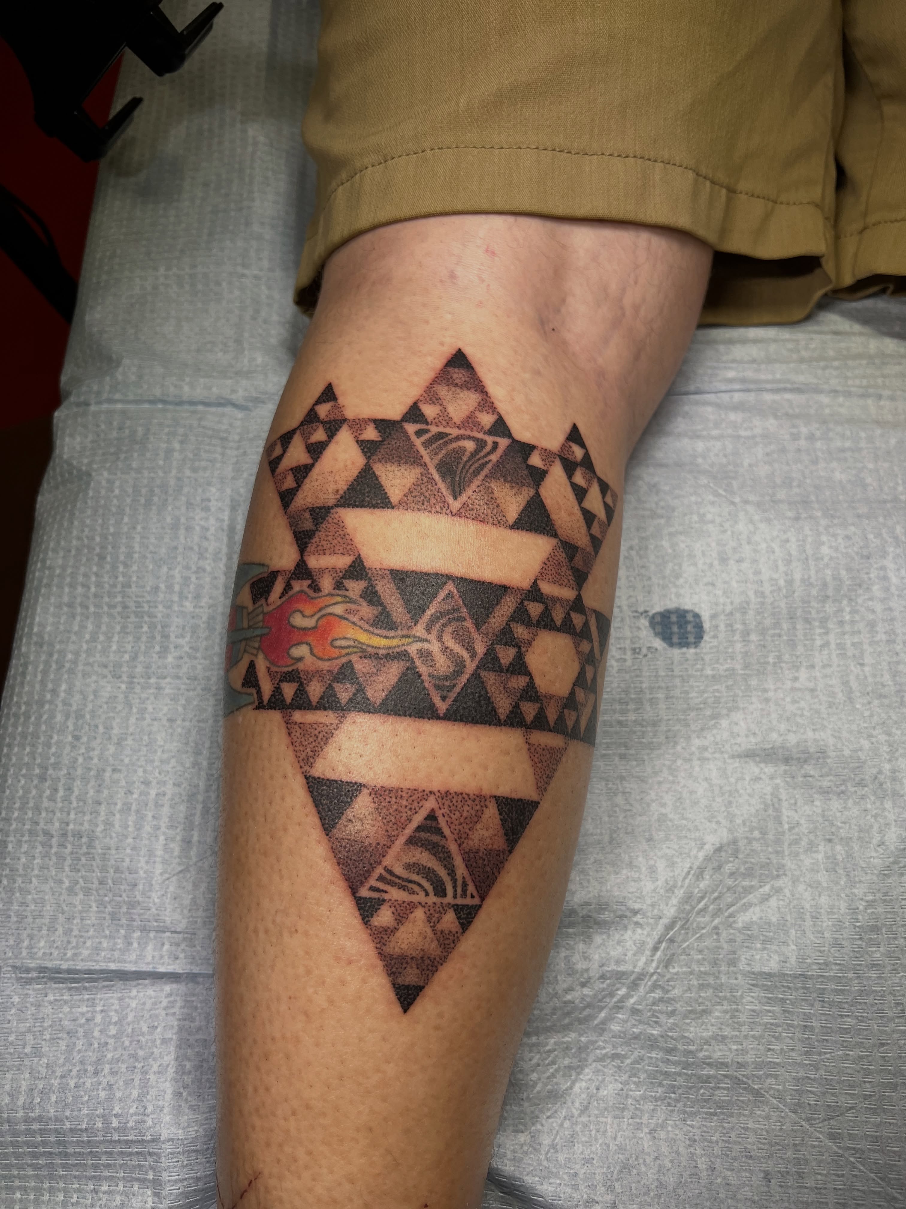 Geometric pattern geometric tattoo on the forearm by Riley