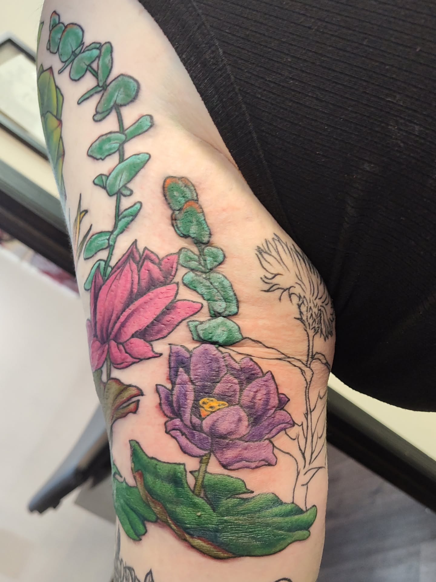 Lotus flowers realism tattoo on the forearm by Mercury