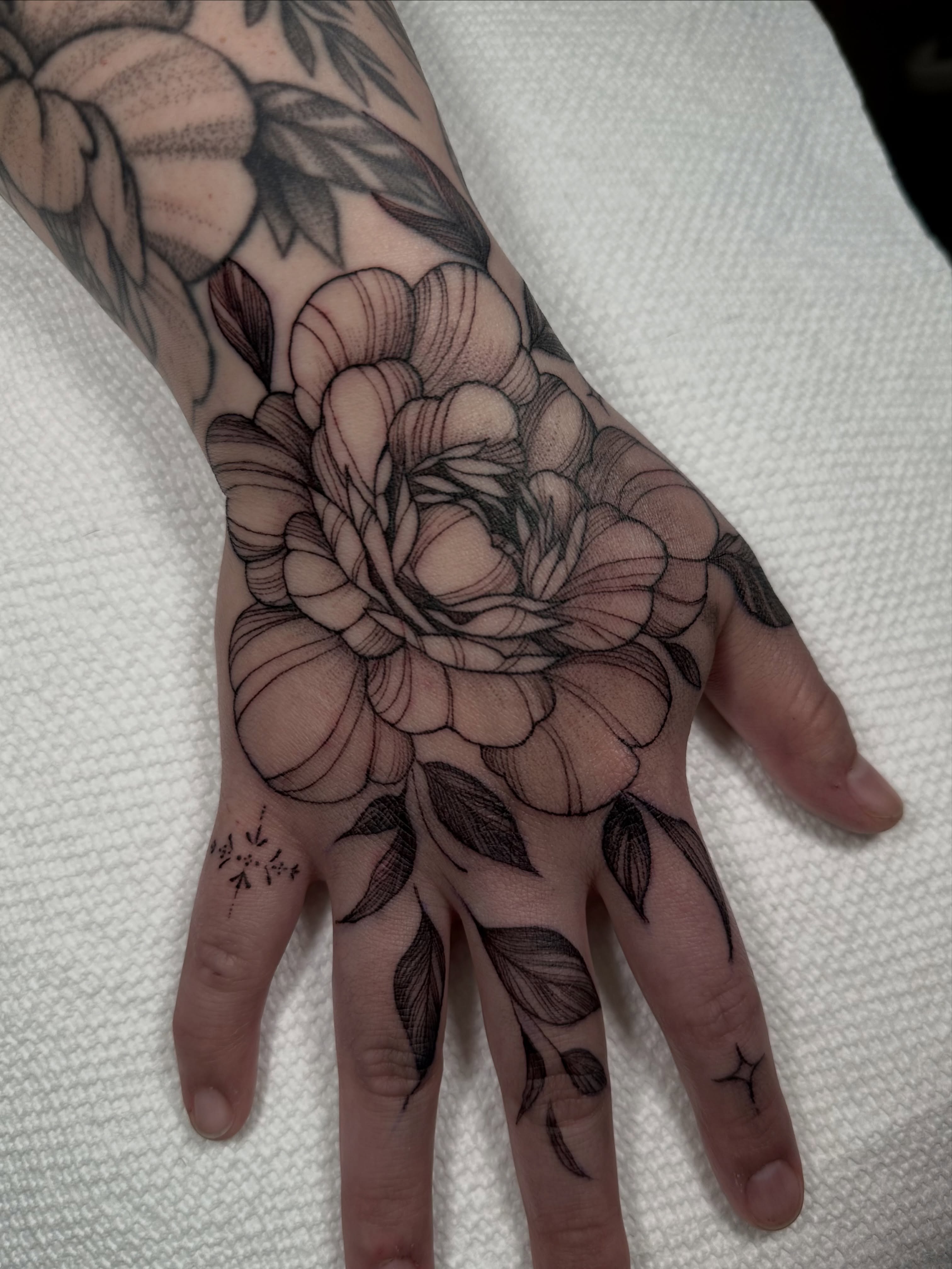 Peony black and grey tattoo on the hand by Dayana✨