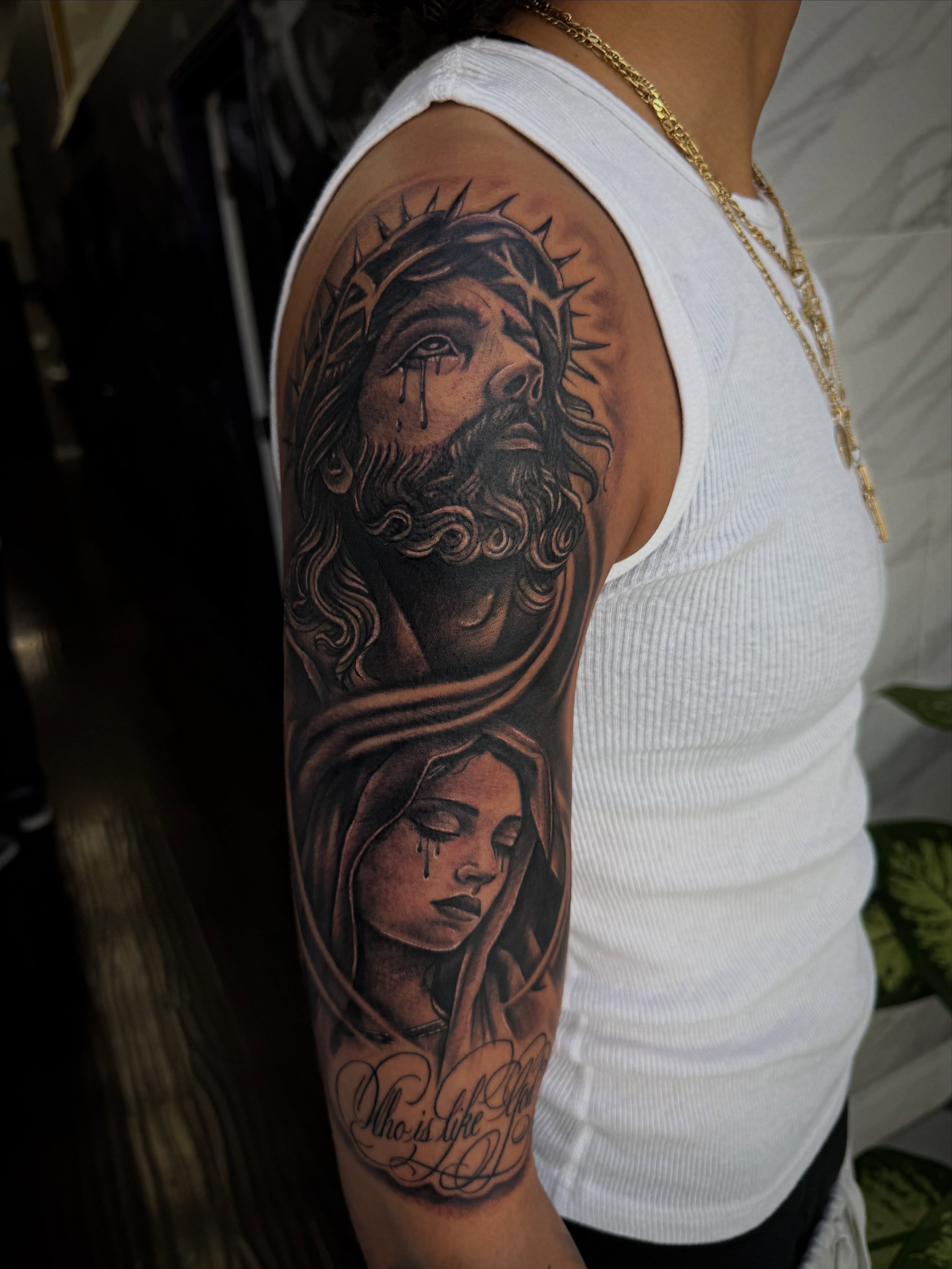 Religious figures realism tattoo on the forearm by @samg_tat2s, San Diego, California