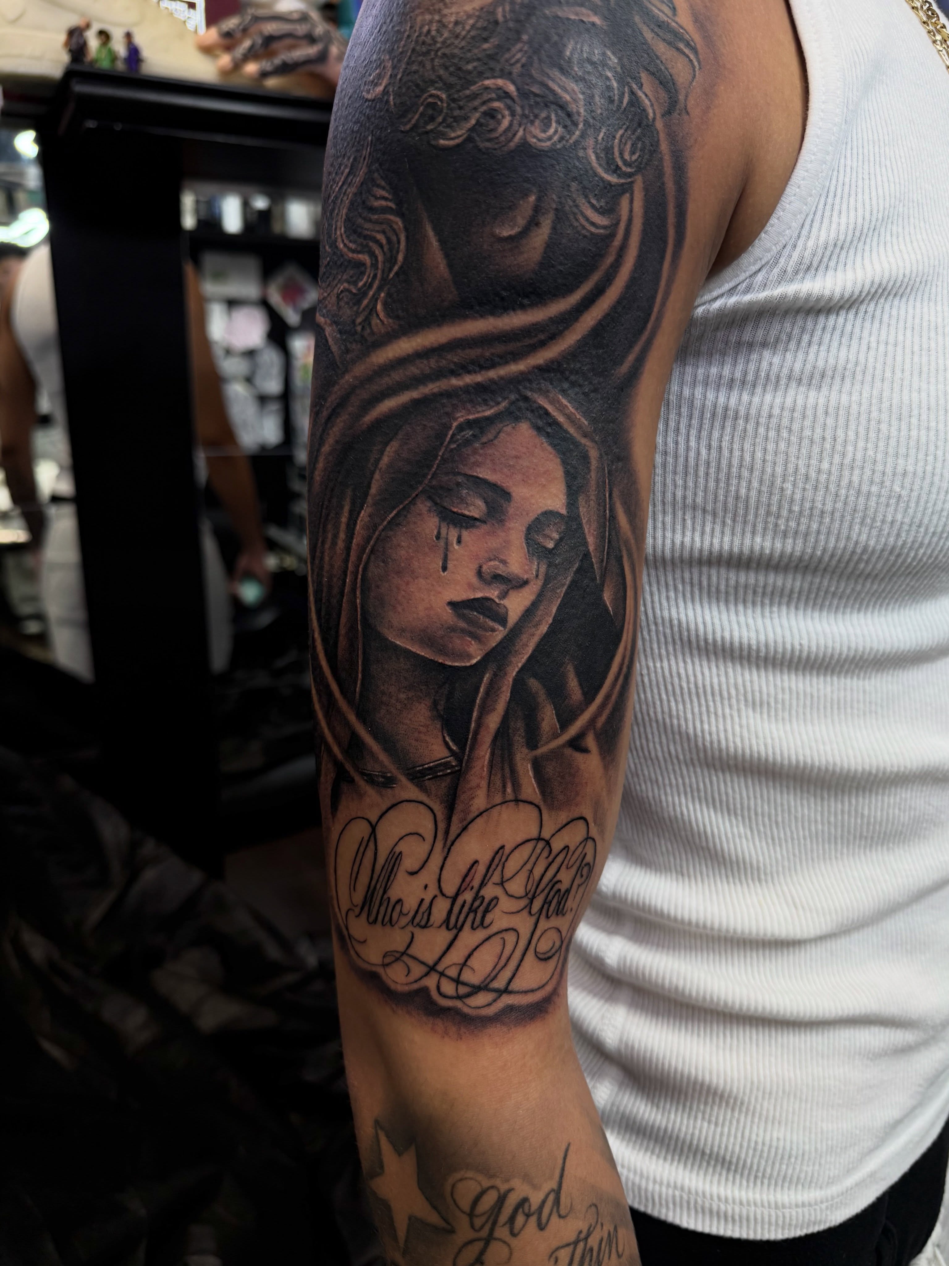 Weeping woman realism tattoo on the forearm by @samg_tat2s, San Diego, California