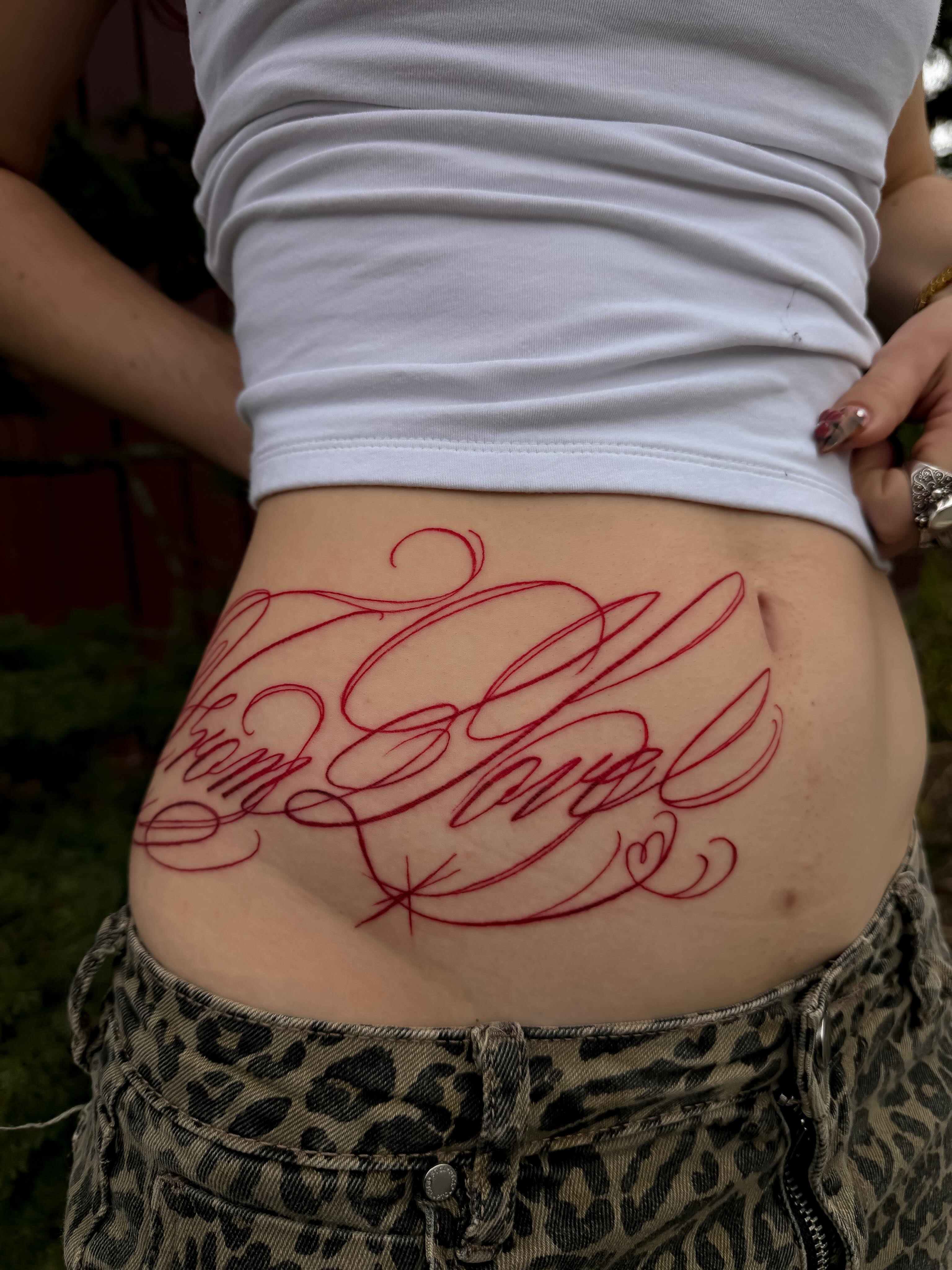 Script lettering lettering script tattoo on the torso by Yvonne