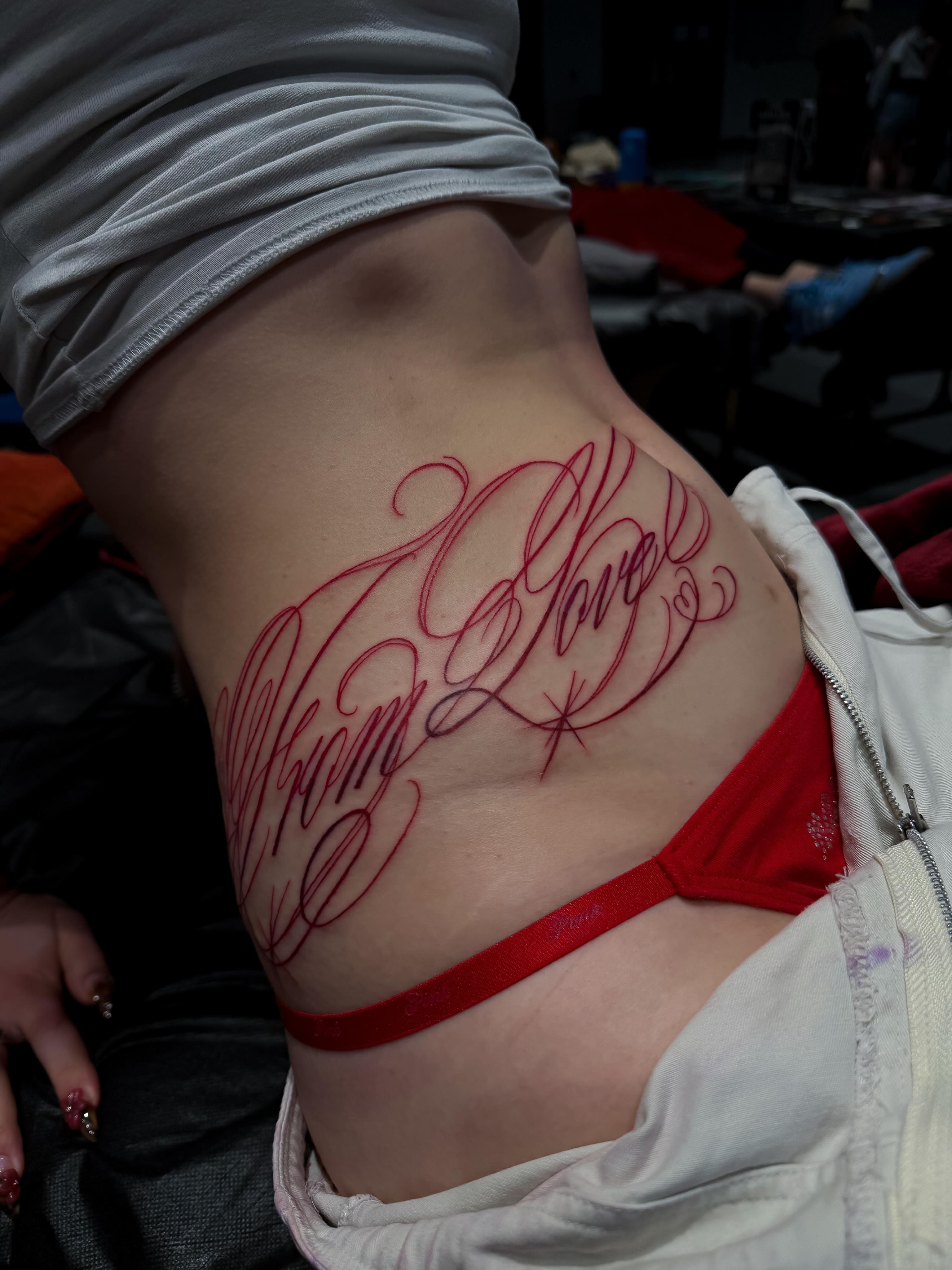 Script lettering lettering script tattoo on the torso by Yvonne