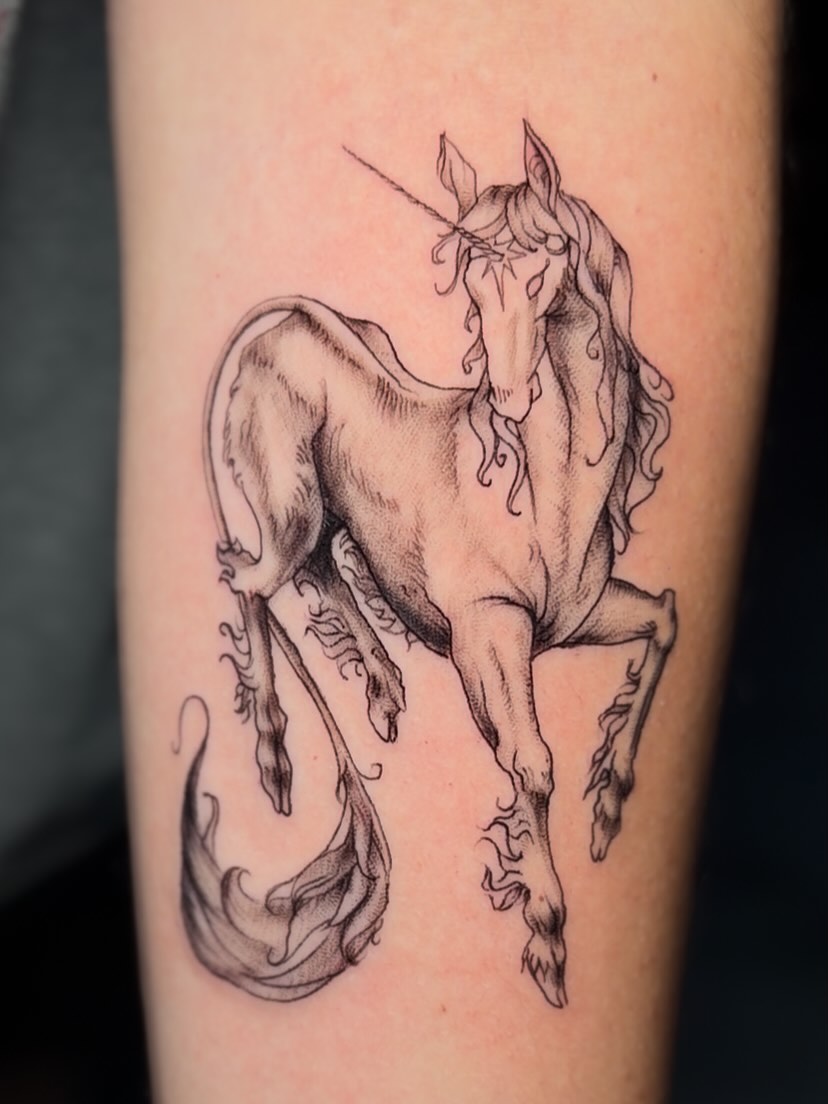 Unicorn black and grey tattoo on the forearm by Exis LHinc, Miami, Florida