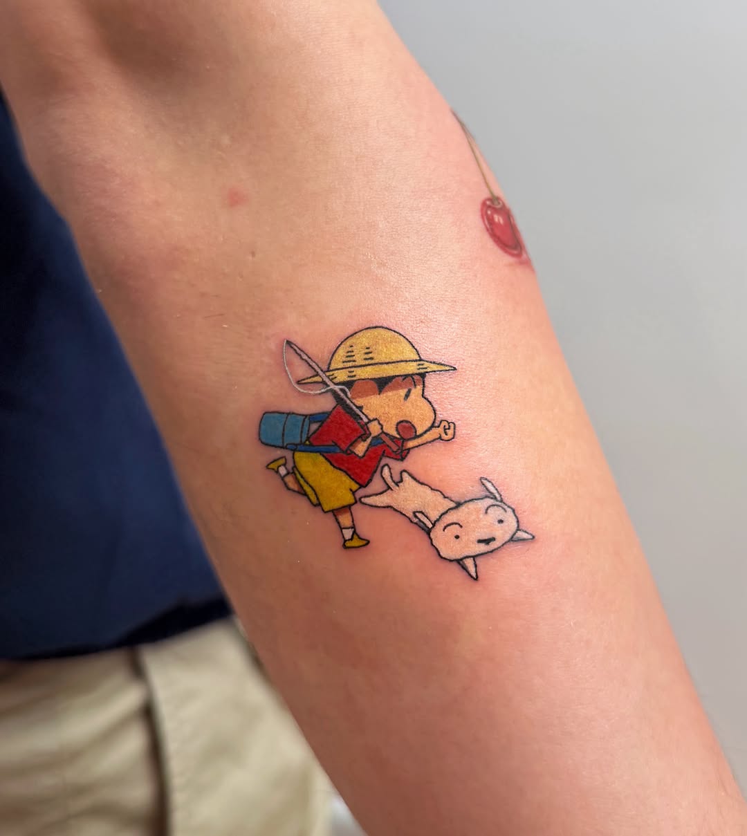 Shin Chan and dog new school tattoo on the forearm by Hery Anwar