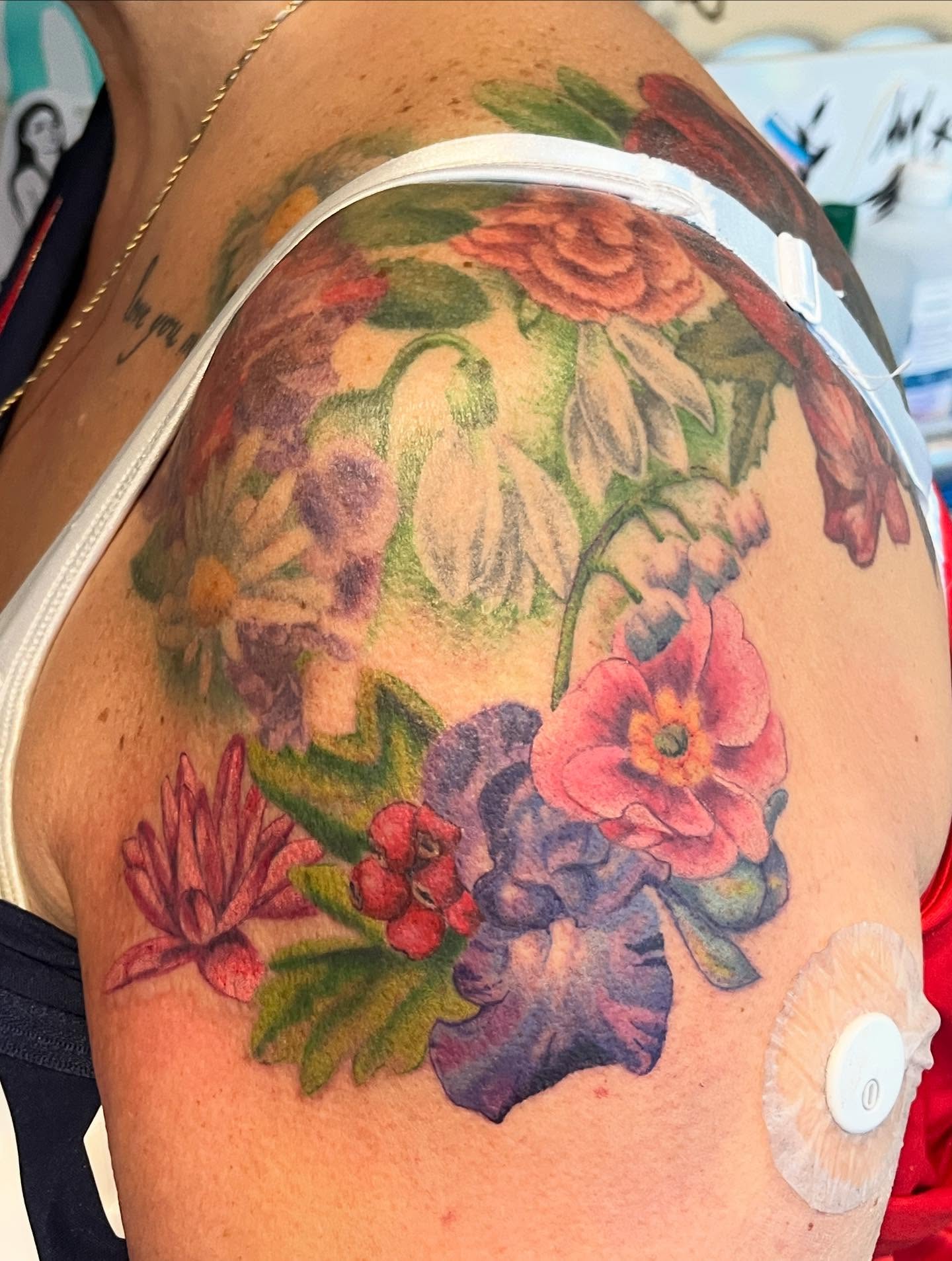 Floral arrangement watercolor tattoo on the shoulder by 🖤Jess Pereira🖤, Framingham, Massachusetts