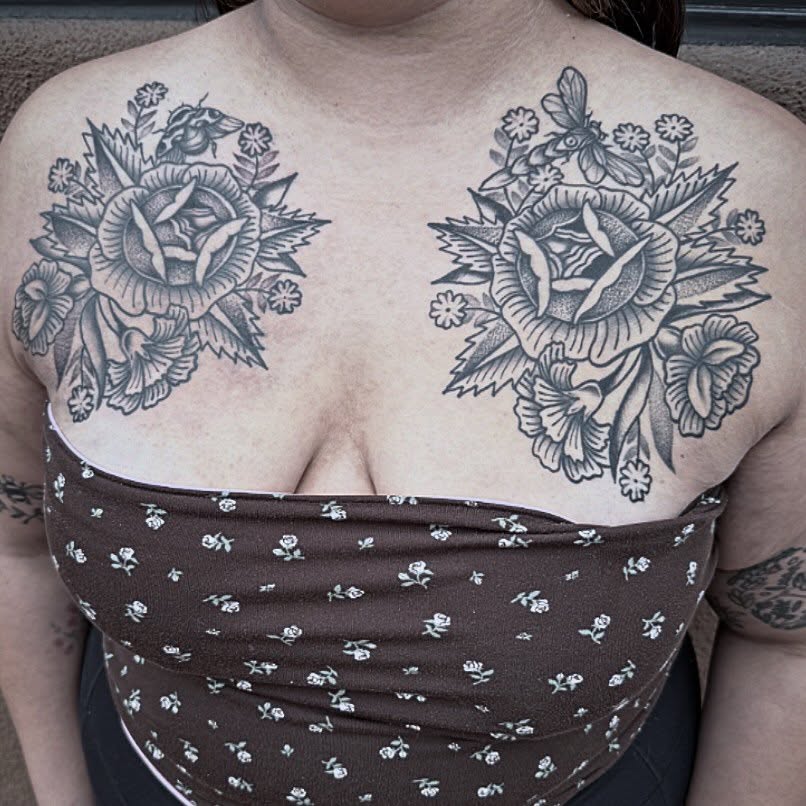 Floral bouquet black and grey tattoo on the chest by Tanya Gomez