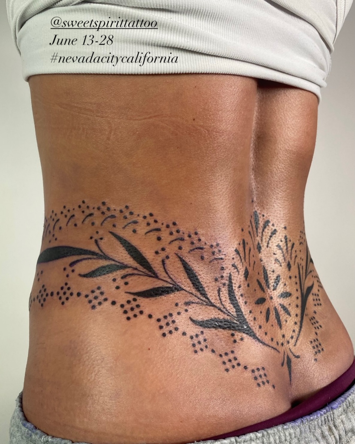 Floral design dotwork tattoo on the torso by Dave Rodriguez