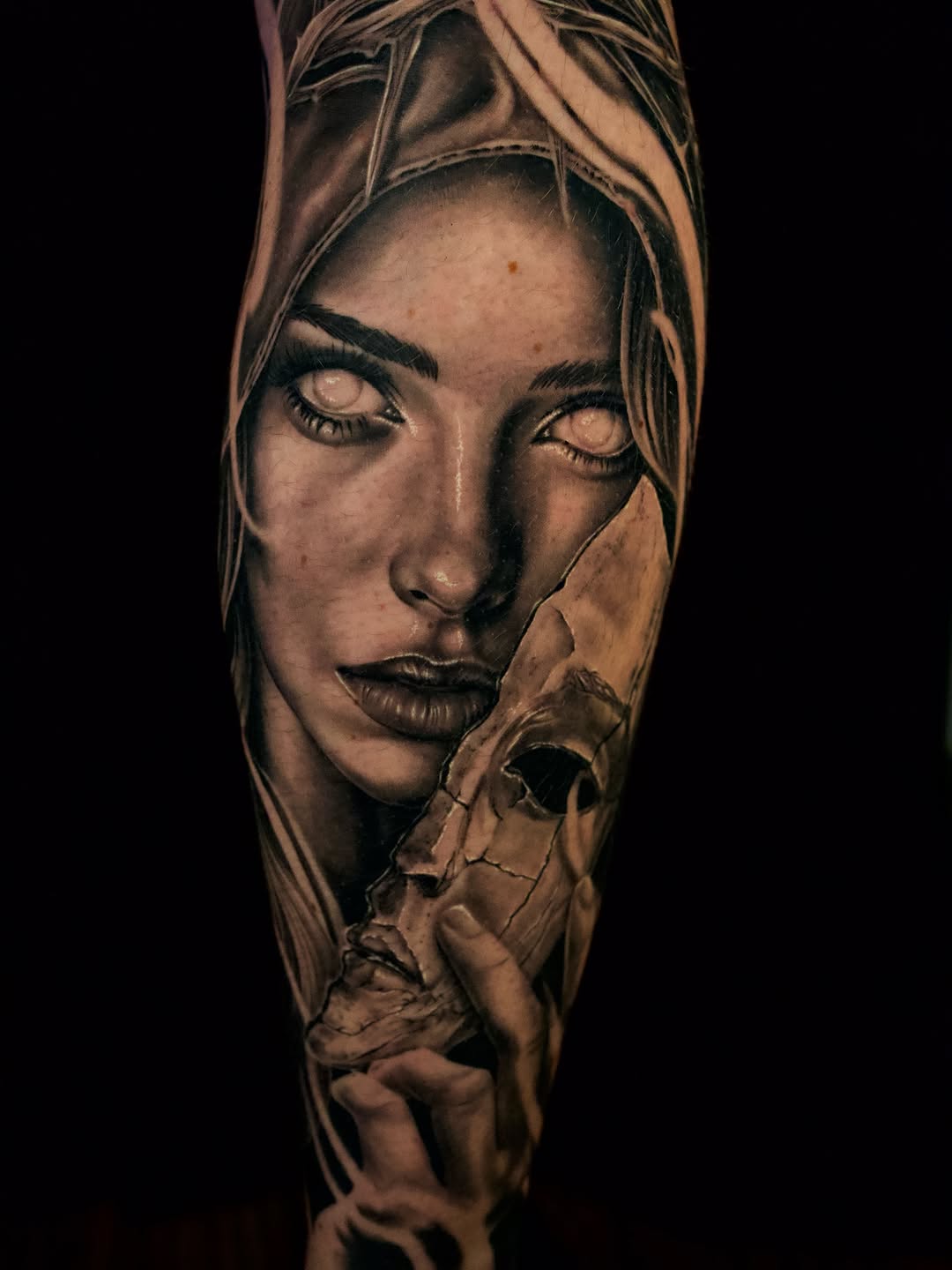 Woman with mask realism tattoo on the forearm by April Lynn