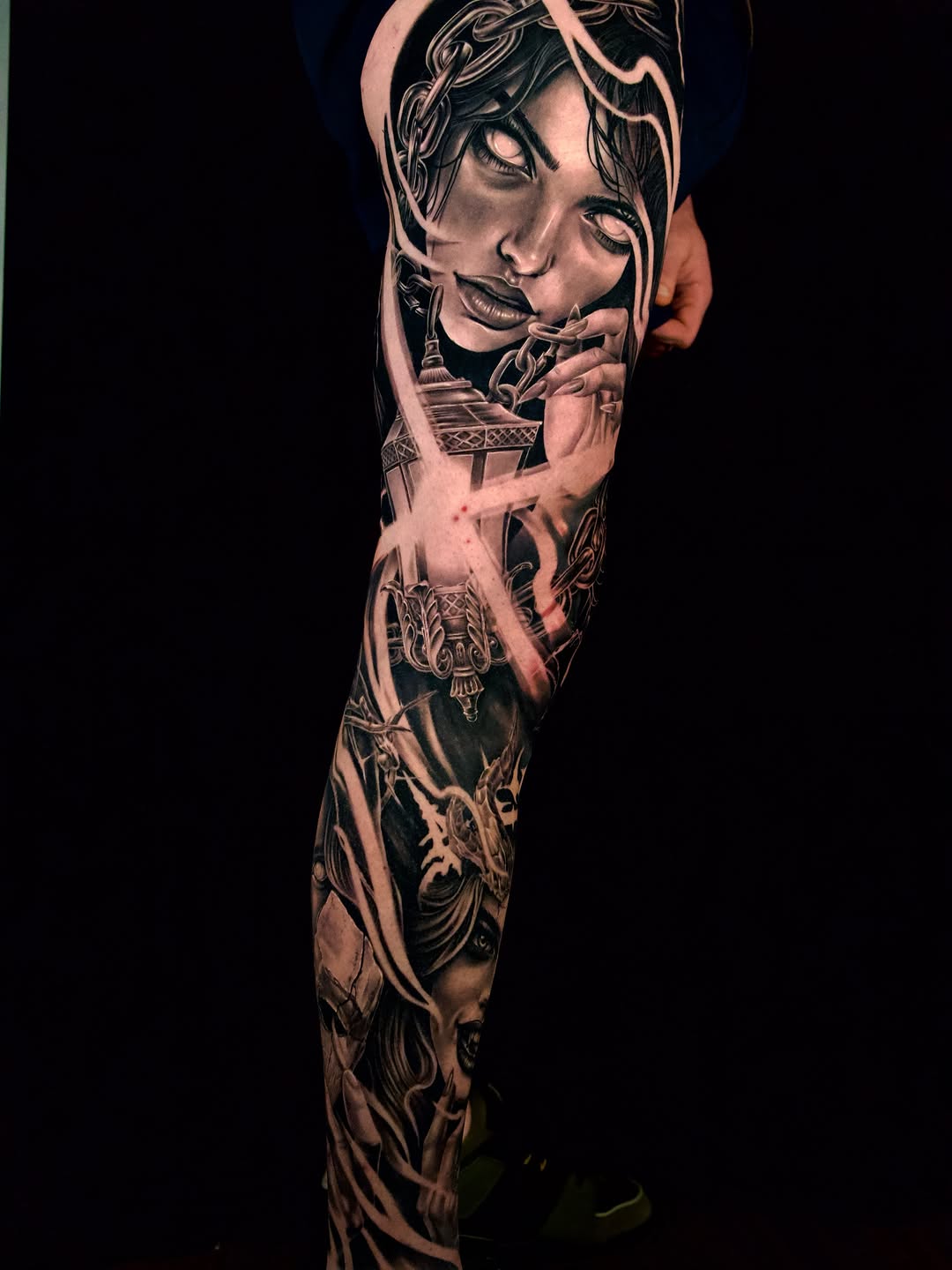 Woman with chains and lantern realism tattoo on the forearm by April Lynn