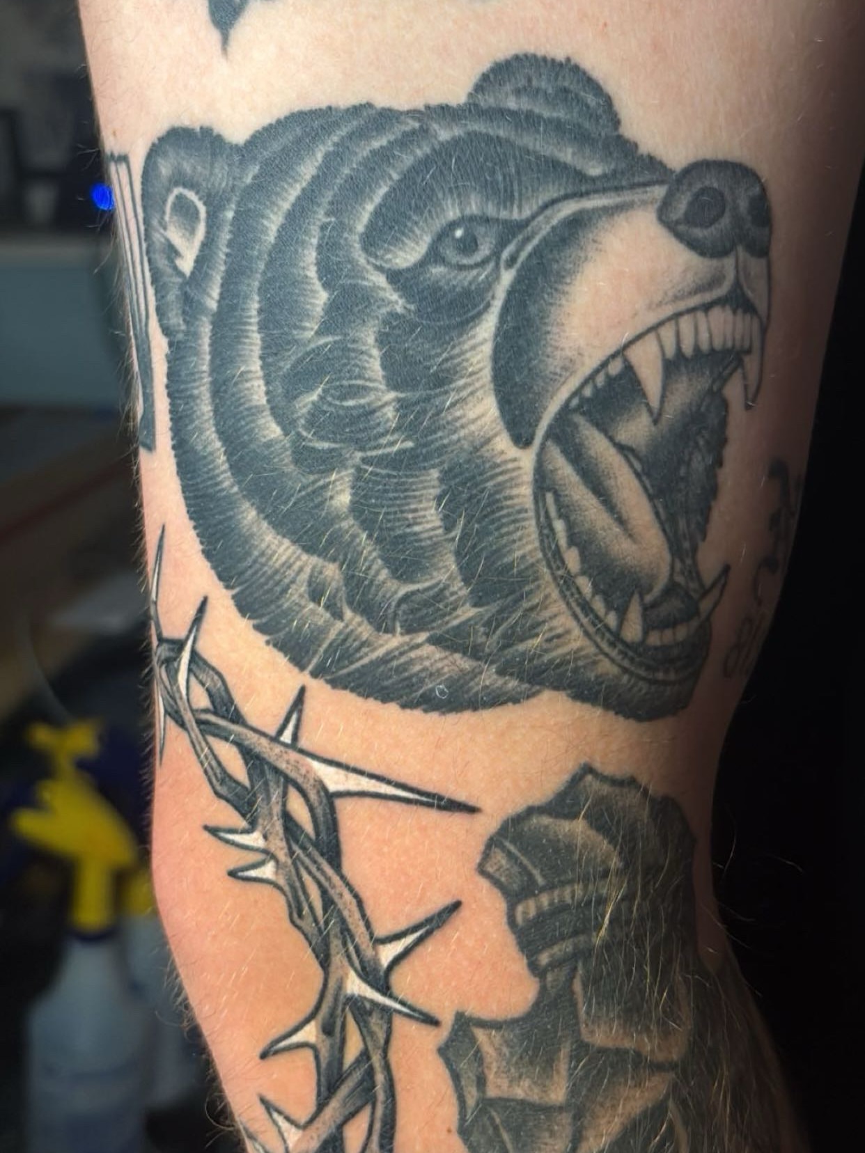 Roaring bear black and grey tattoo on the forearm by Chris Prince Jr., Miamisburg, Ohio