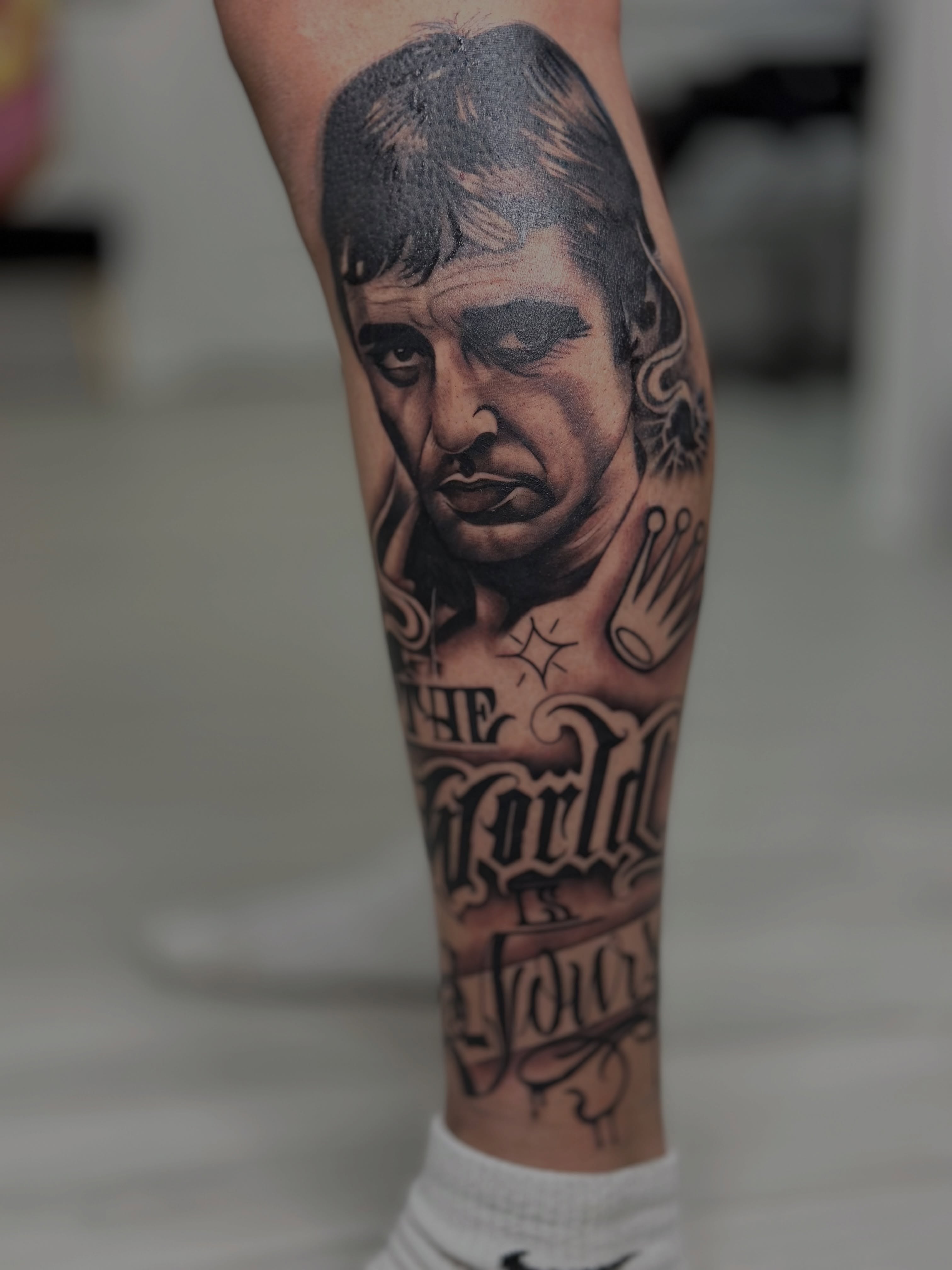 Portrait realism tattoo on the forearm by Savannah Tattoo Artist