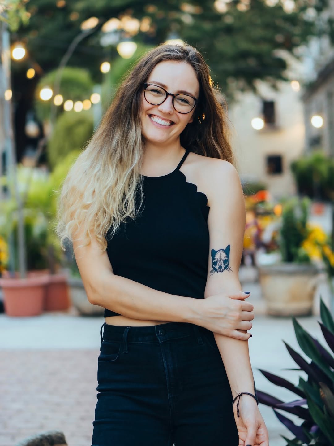 Cat skull tattoo on the forearm by Amy