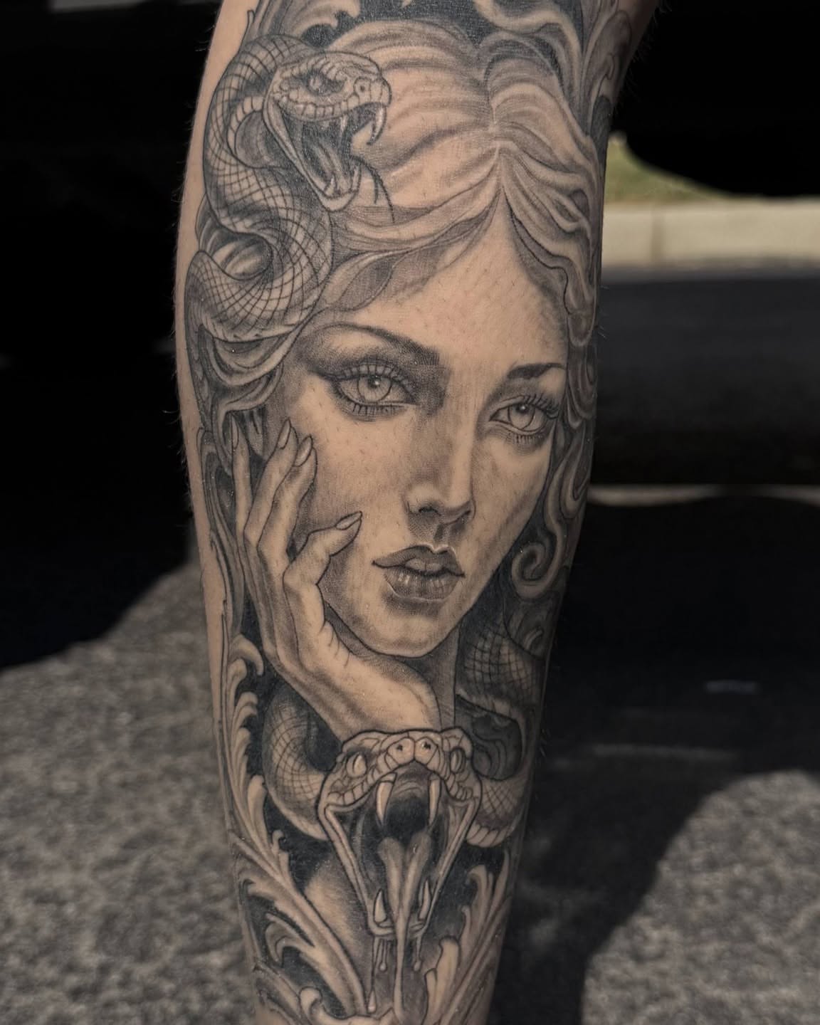 Woman with snakes realism tattoo on the forearm by Danny Stewart