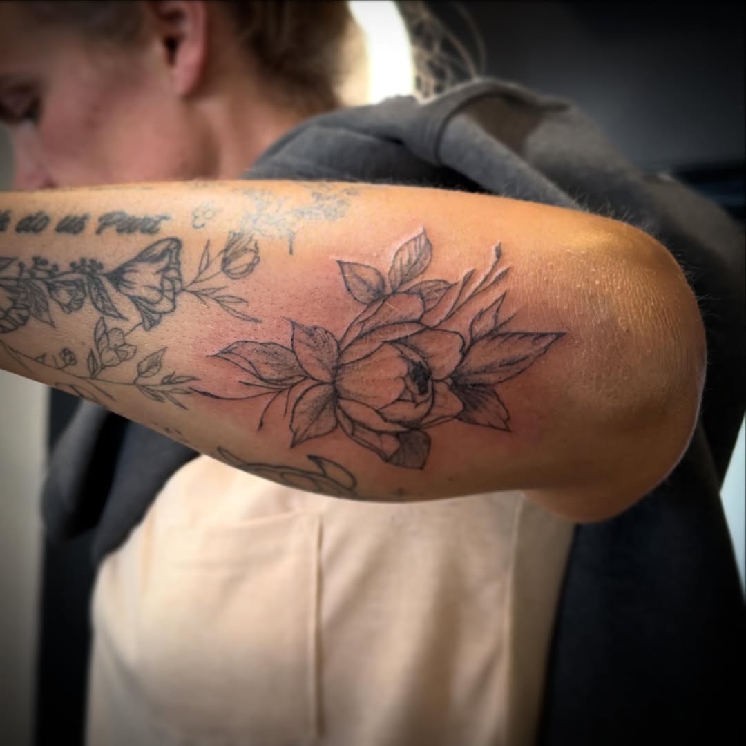 Floral bouquet black and grey tattoo on the forearm by TolzinInk, Brookings, South Dakota