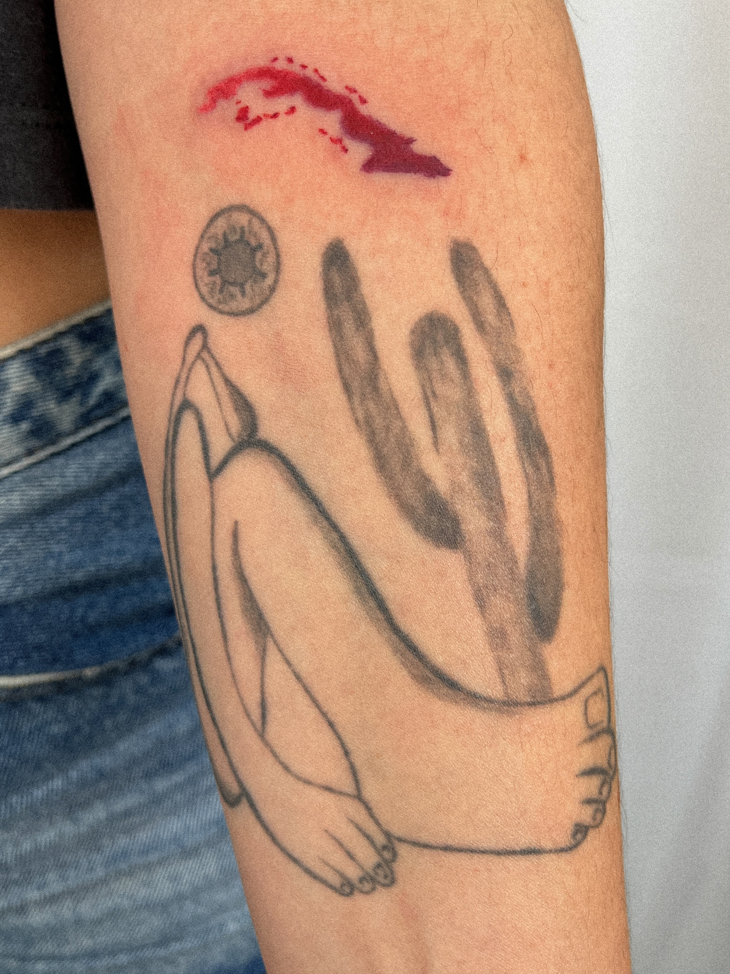 Child with hands covering face black and grey tattoo on the forearm by júlia sanches ✦︎
