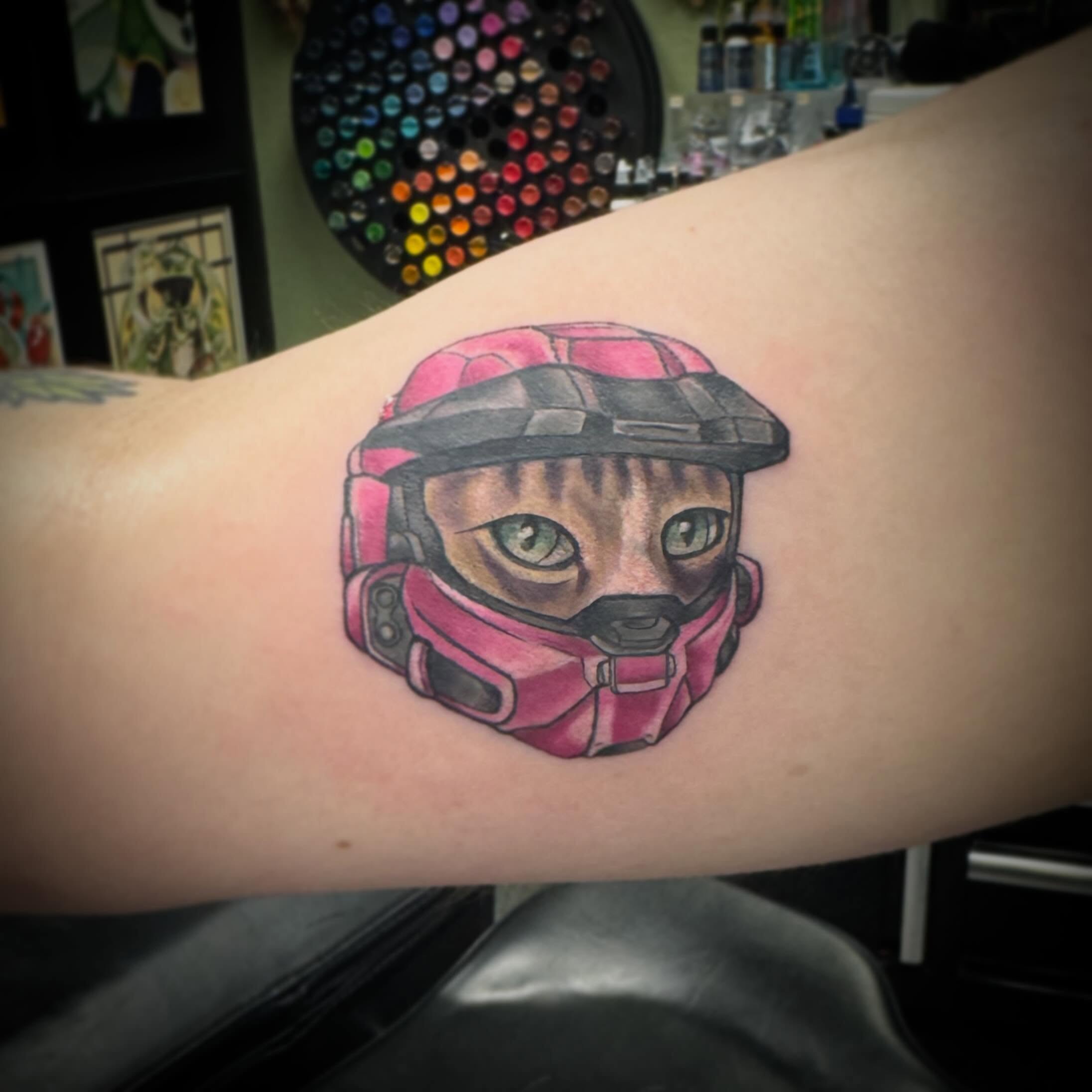 Cat wearing helmet realism tattoo on the forearm by Darbi "Marbles"