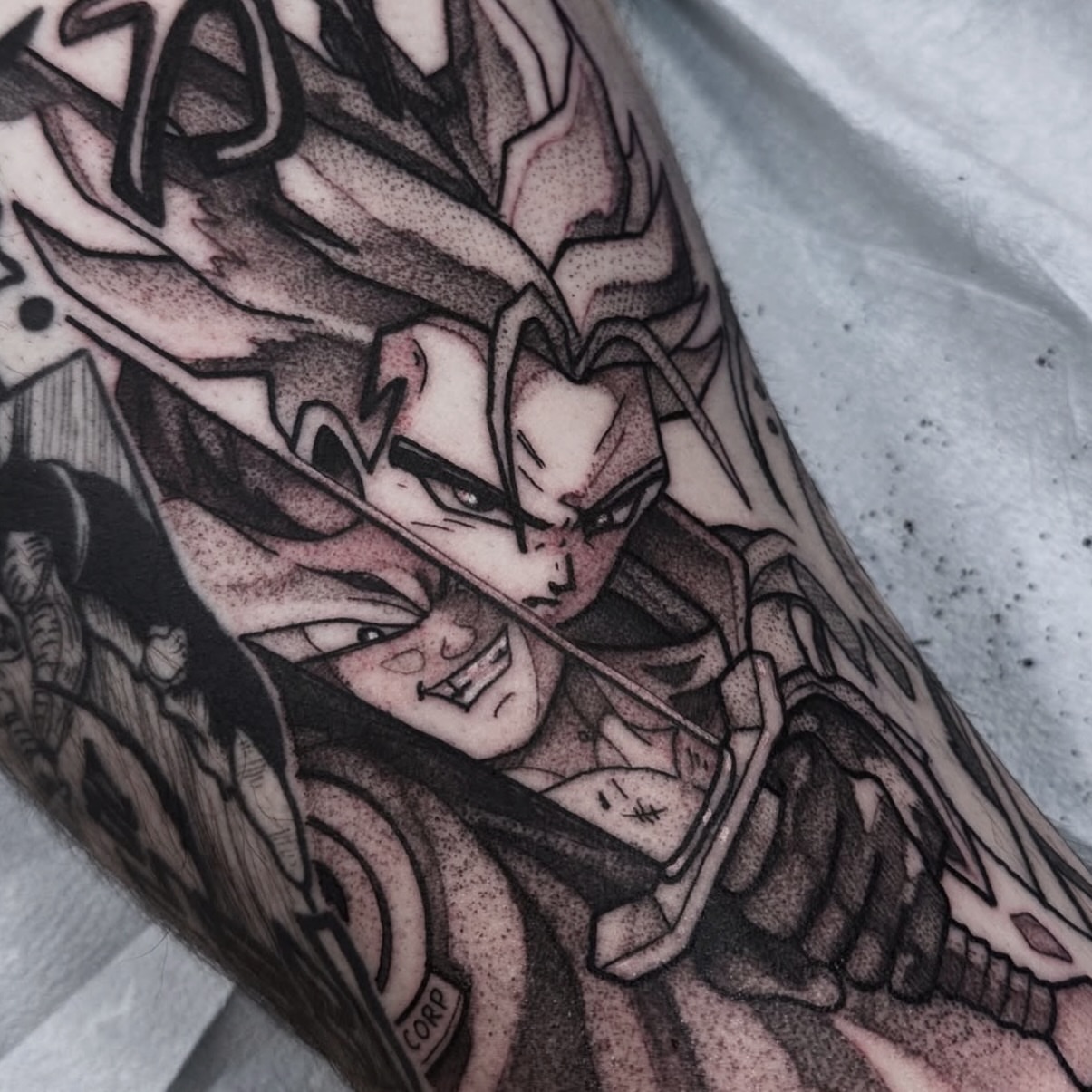 Dragon ball character anime tattoo on the forearm by Christopher Layman
