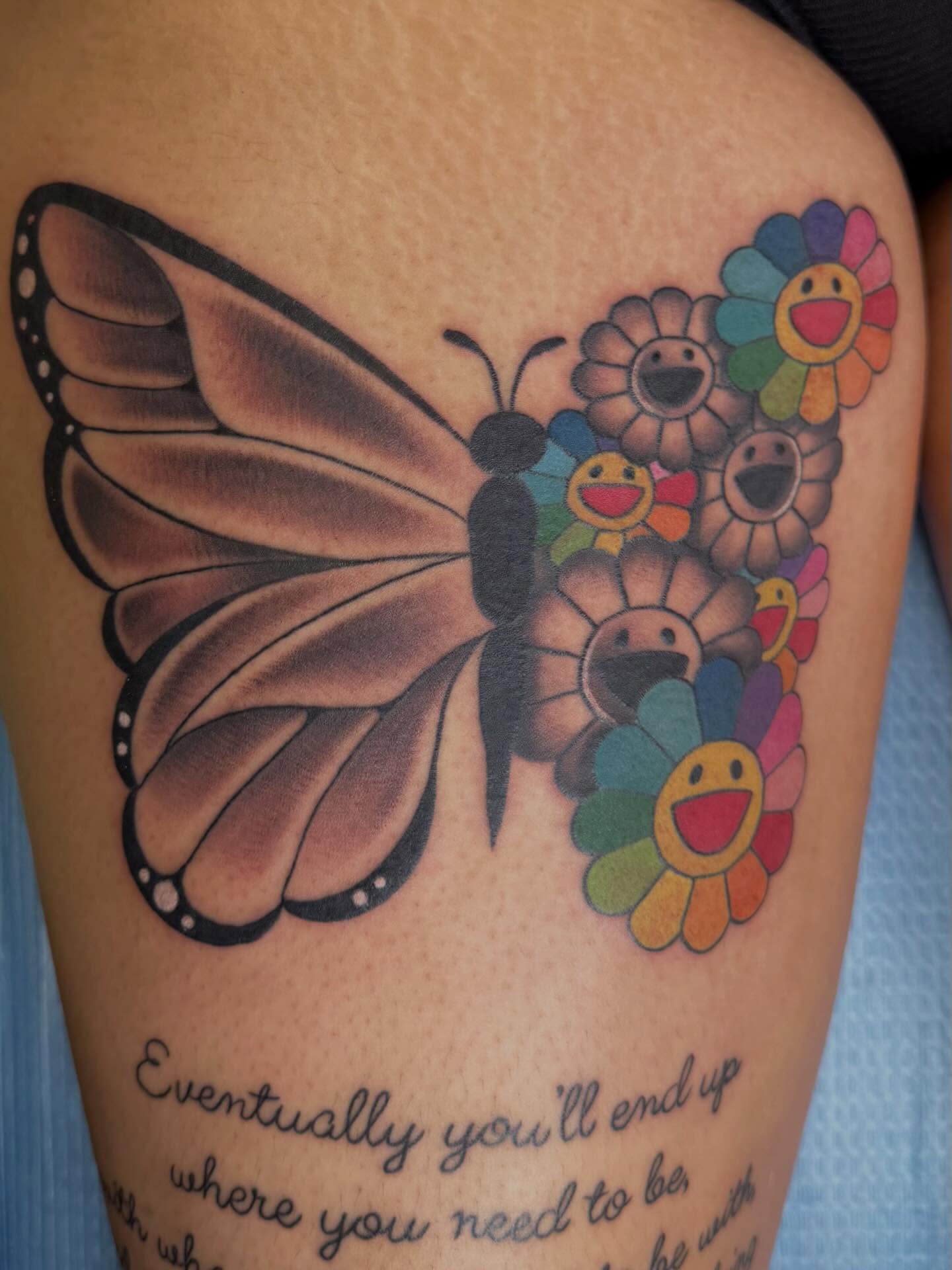 Butterfly and flowers new school tattoo on the thigh by linda perez