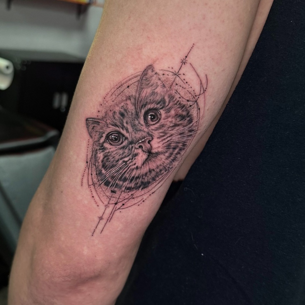 Cat portrait with geometric elements realism tattoo on the forearm by Tattoo Artist Vanessa